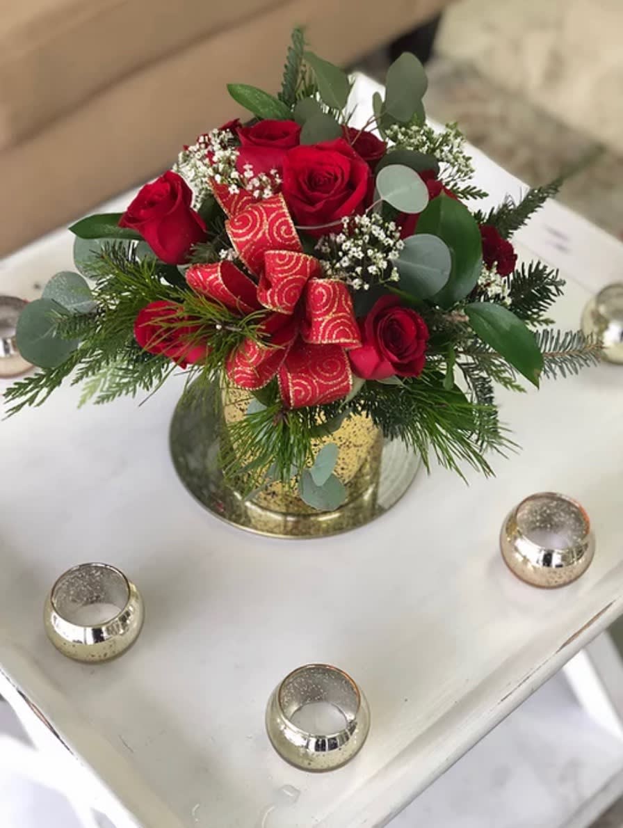 The Nice list - A gold keepsake vase with our freshest christmas greens and red roses, with a bow to top it off