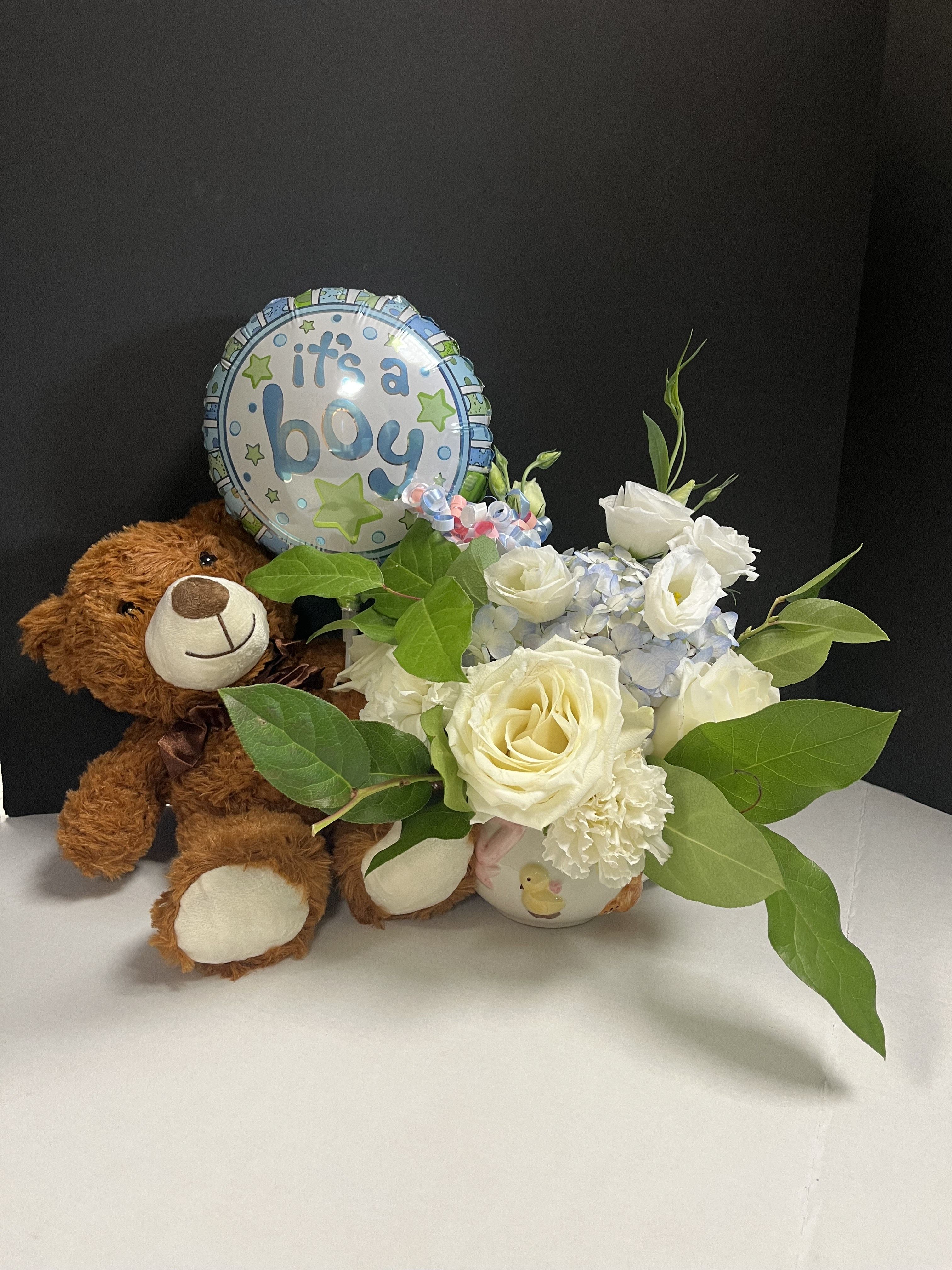 Its a Boy - A keepsake flower cup filled with flowers along with a teddy bear and a balloon