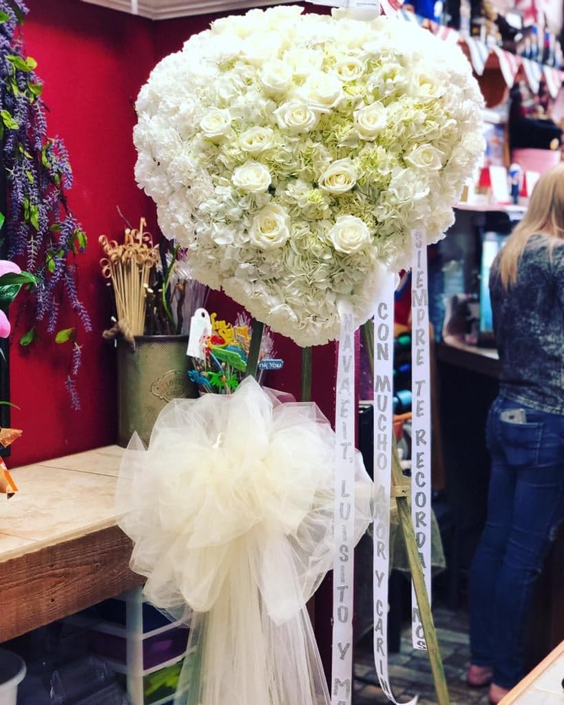 Heavenly Heart - This solid heart-standing spray makes a beautiful statement about your heartfelt compassion and sympathy. Filled to the max with white flowers. 