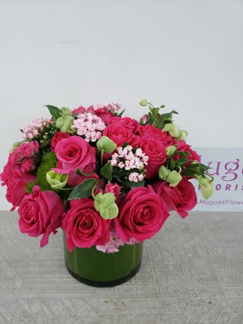 Cherry Blossom Dreams: A Captivating Roses Flower Arrangement - In the world of flowers, the enchanting charm of cherry blossoms captures hearts with their delicate beauty and fleeting nature. The &quot;Cherry Roses&quot; flower arrangement intertwines the elegance of roses with the notion of cherry blossoms, creating a bouquet that speaks of grace, romance, and dreams. Join us as we explore the petals of this arrangement, where the allure of roses meets the enchantment of cherry blossoms.  This arrangement includes a newly cleaned vase and good quality water &amp; flower food. Varieties and colors of flowers may vary according to season and availability.  Item: 156  Care Instructions: For the best vase life, change the water every two days.  