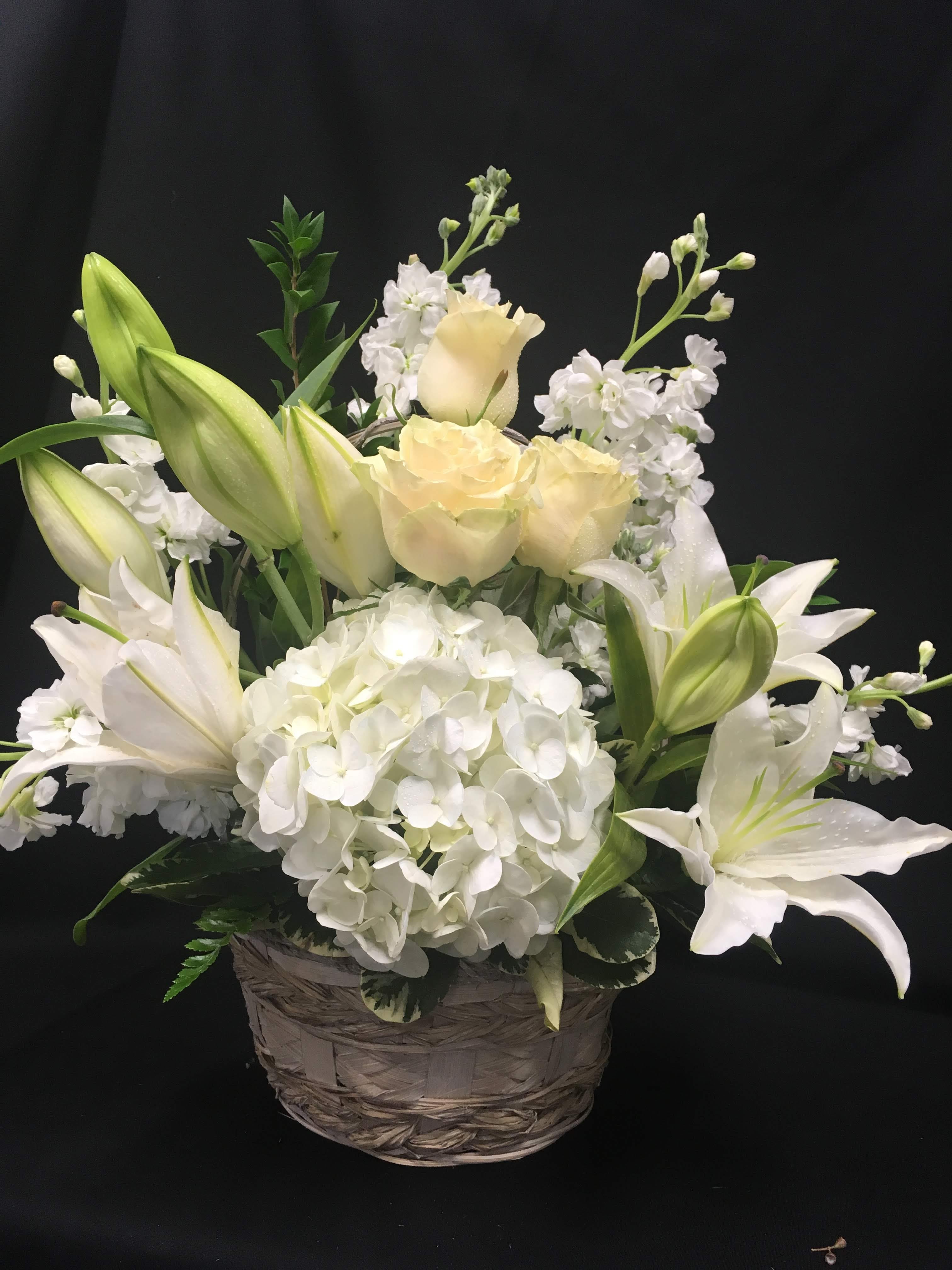 White surprise - Basket of all white fflowers hydrangea, roses, stargazer lilies, stock and greens