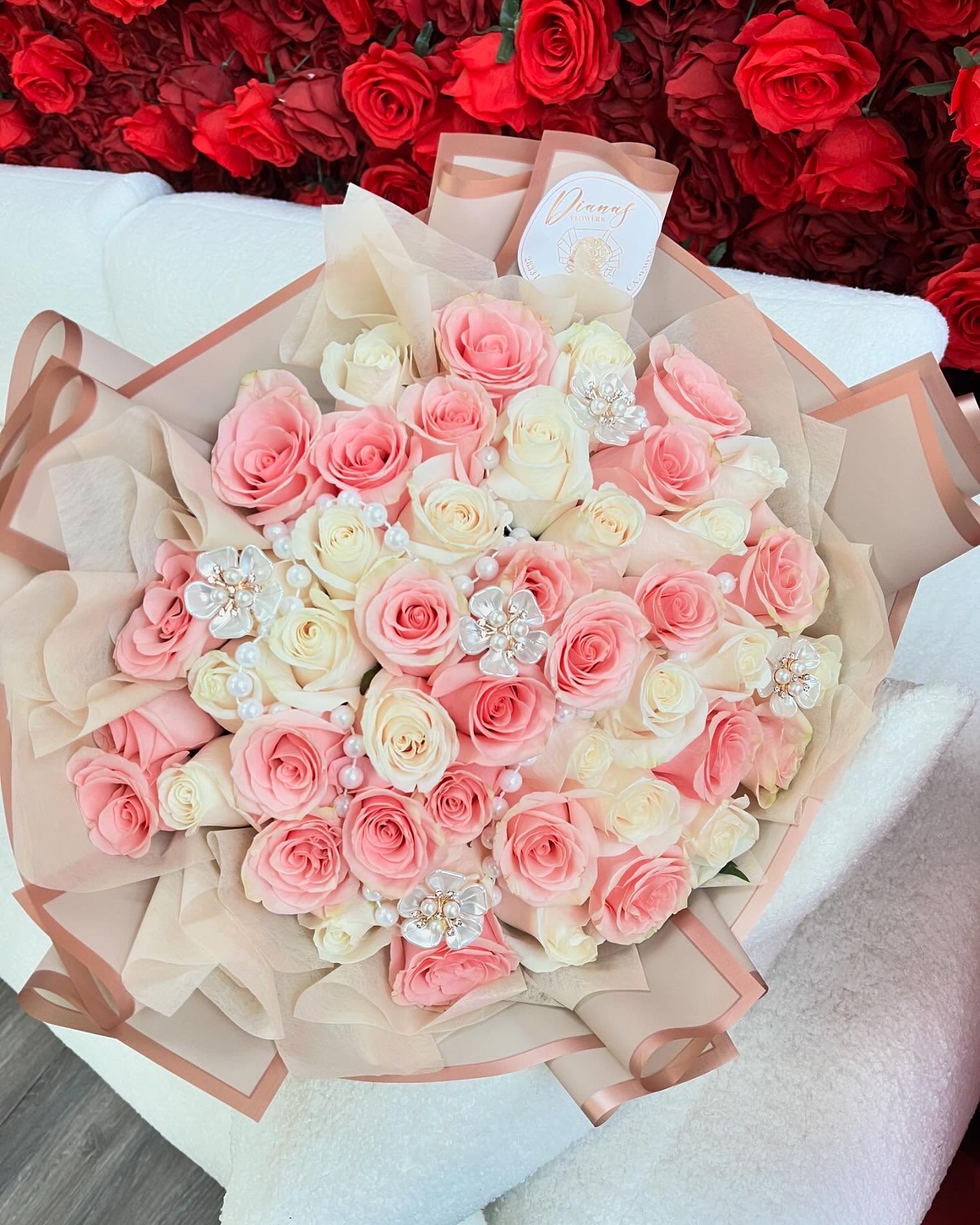 Soft Pearl Bouquet - A delicate mix of white and light pink roses, accented with elegant pearls and pearly flower pins for a touch of sophistication.   **Note pictured is PREMIUM size**