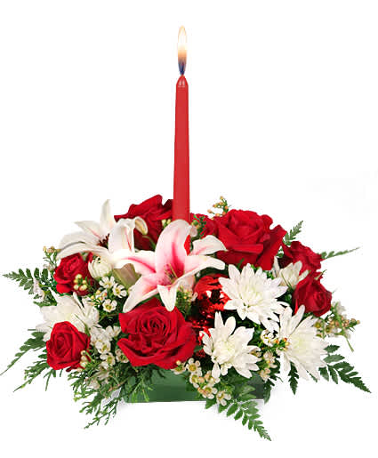 DECK THE HALLS HOLIDAY CENTERPIECE  - Whether you're sending season's greetings from afar or just trying to curry favour before you arrive, we've got a great mix of Christmas flowers for you to send. .Every family has its own holiday traditions. Let us help you add one more with our classic Christmas centerpiece! With red roses, Stargazer lilies, white cushion poms, and white waxflowers, Deck the Halls is sure to captivate all who see it. Cheery and festive, this centerpiece will be a darling addition to any holiday table! 