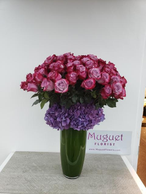 Deep Purple Elegance: A Floral Symphony in Rich Hues - Deep purple is a color that exudes richness, mystery, and a touch of regal elegance. The &quot;Deep Purple Elegance&quot; arrangement captures the essence of this captivating hue in a stunning composition. Each element within this arrangement is carefully selected to convey the sense of luxury and sophistication that deep purple represents. Join us as we explore the petals of this arrangement, where each bloom becomes a testament to the exquisite beauty found in deep, lustrous shades.   The varieties and colors of flowers may vary according to the season and availability. This arrangement includes a newly cleaned vase and good-quality water &amp; flower food.  Item: #1322  Care Instructions: Change the water every 2 days for optimal vase life.