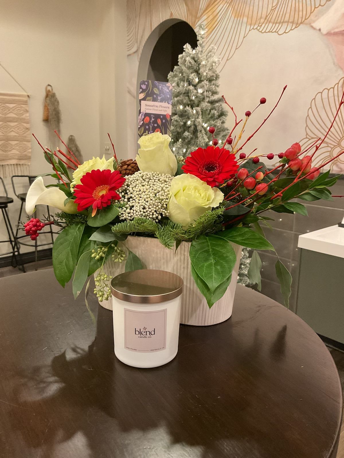 Riveting Winter Romance - Beautiful basket of Roses  ,Cala Lillies and gerber daisies .This arrangement includes a sweet aroma to capture your senses from Blend candle Co.Candle is Mixed with White Birch &amp; Frasier Fir