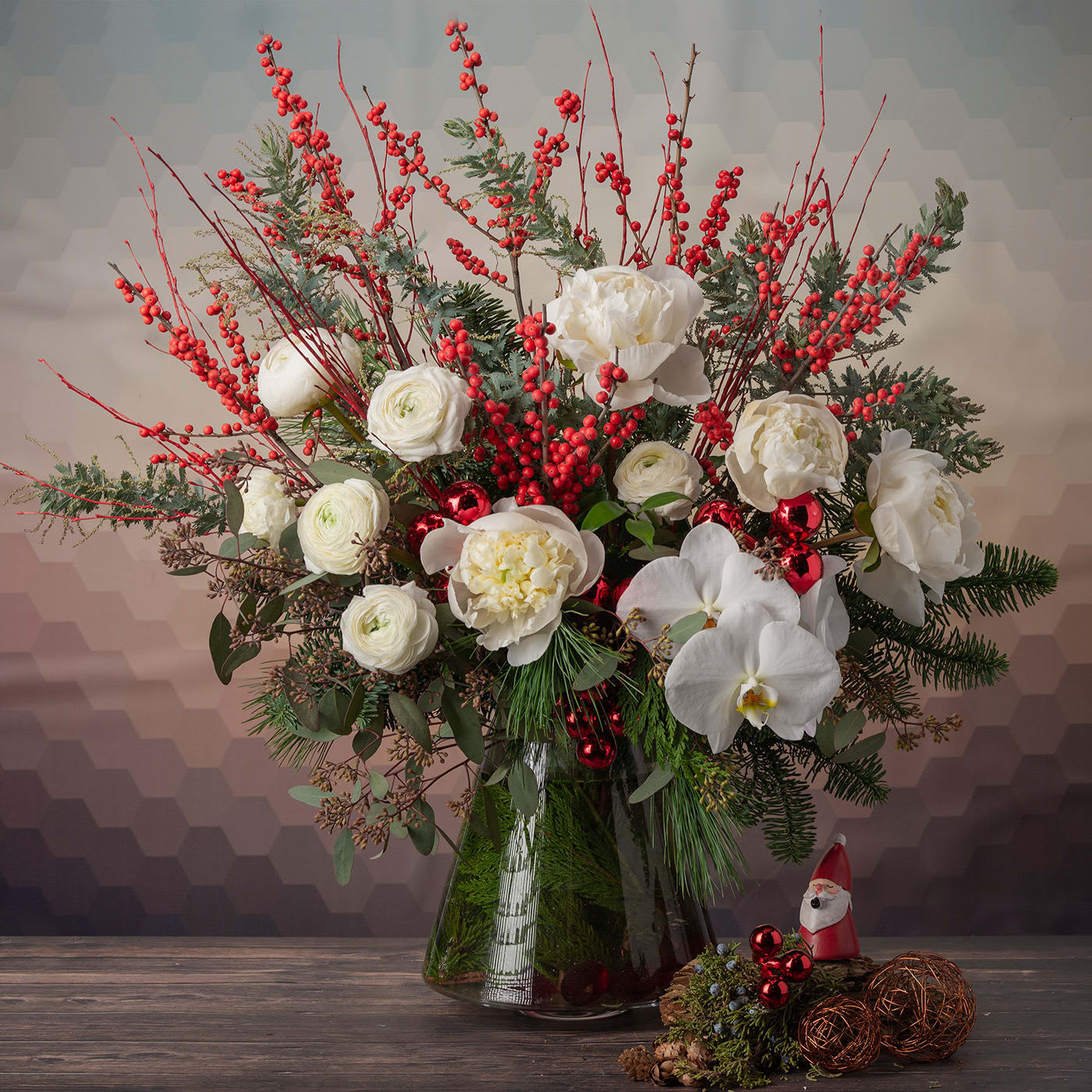 All I want This Christmas - Celeberate Christmas with this  lush and vibrant floral arrangement. Ilex berries, Peony, Ranunculus ,Orchid and Christmas greens