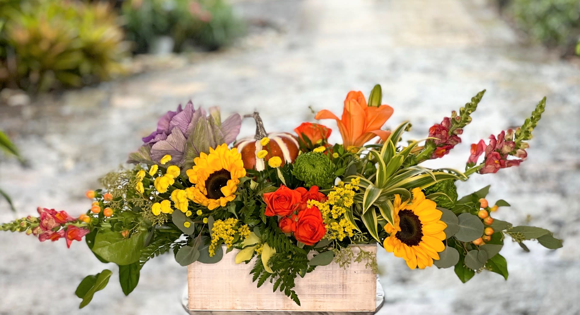 Autumn Harvest - A gorgeous mix of sunflowers, mini garden roses and other fresh flowers in beautiful fall colors.
