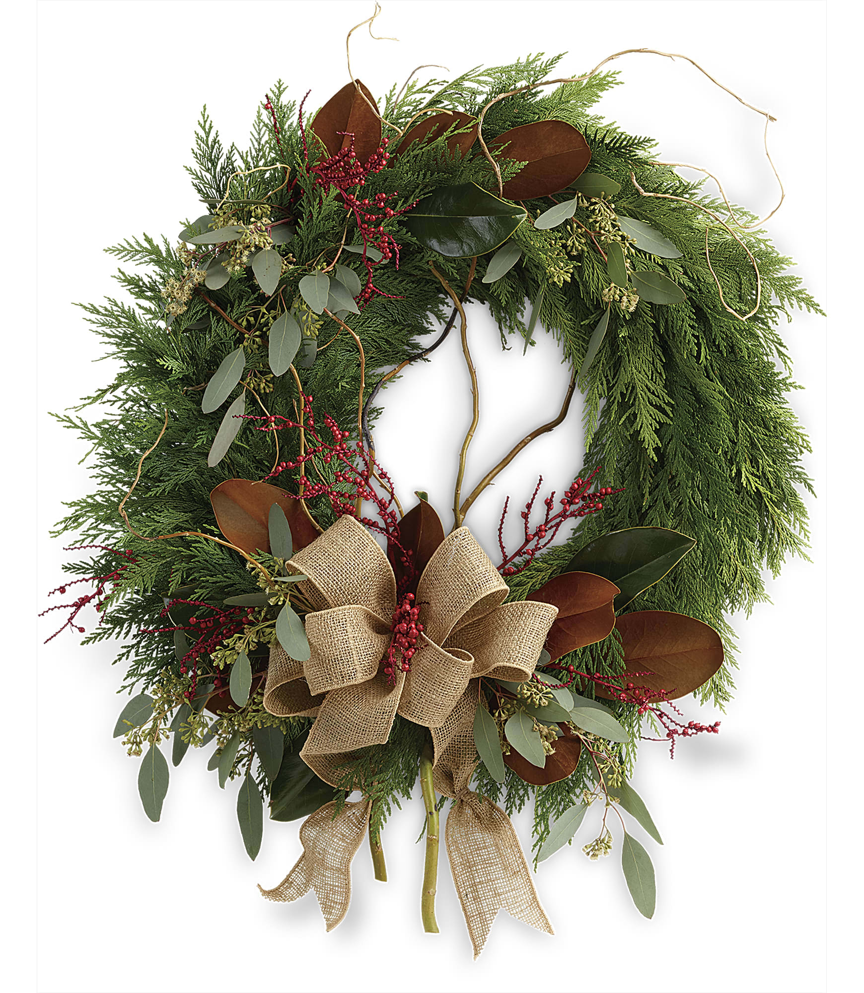 Rustic Holiday Wreath  - Capture the rustic beauty of the winter forest with this wondrous flat cedar wreath, dressed up for the holidays with burlap ribbon and a spray of red Christmas berries! This wondrous wreath includes flat cedar, curly willow, seeded eucalyptus, and magnolia leaves. Approximately 24&quot; W x 29 1/2&quot; H