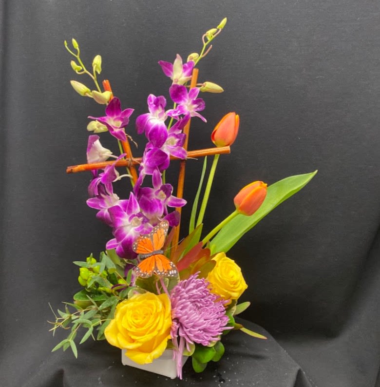 Twinkly eyes - High style tropical mixed dendrobium orchids, roses, hypericum berries, tulips lavender spider mum