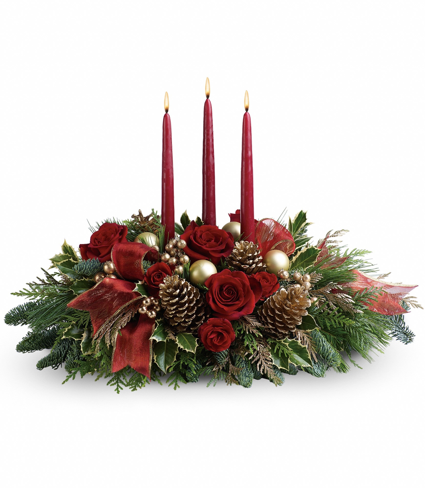 All Is Bright Centerpiece  - All will be bright this season when you order this joyful Christmas arrangement. A lovely centerpiece, it will light up the holiday festivities beautifully. Roses and spray roses are artfully on display with merry touches like shimmery ornaments, pinecones, berries, organza ribbon and holiday greens. Three graceful red taper candles add the perfect magical touch. Approximately 23&quot; W x 16&quot; H
