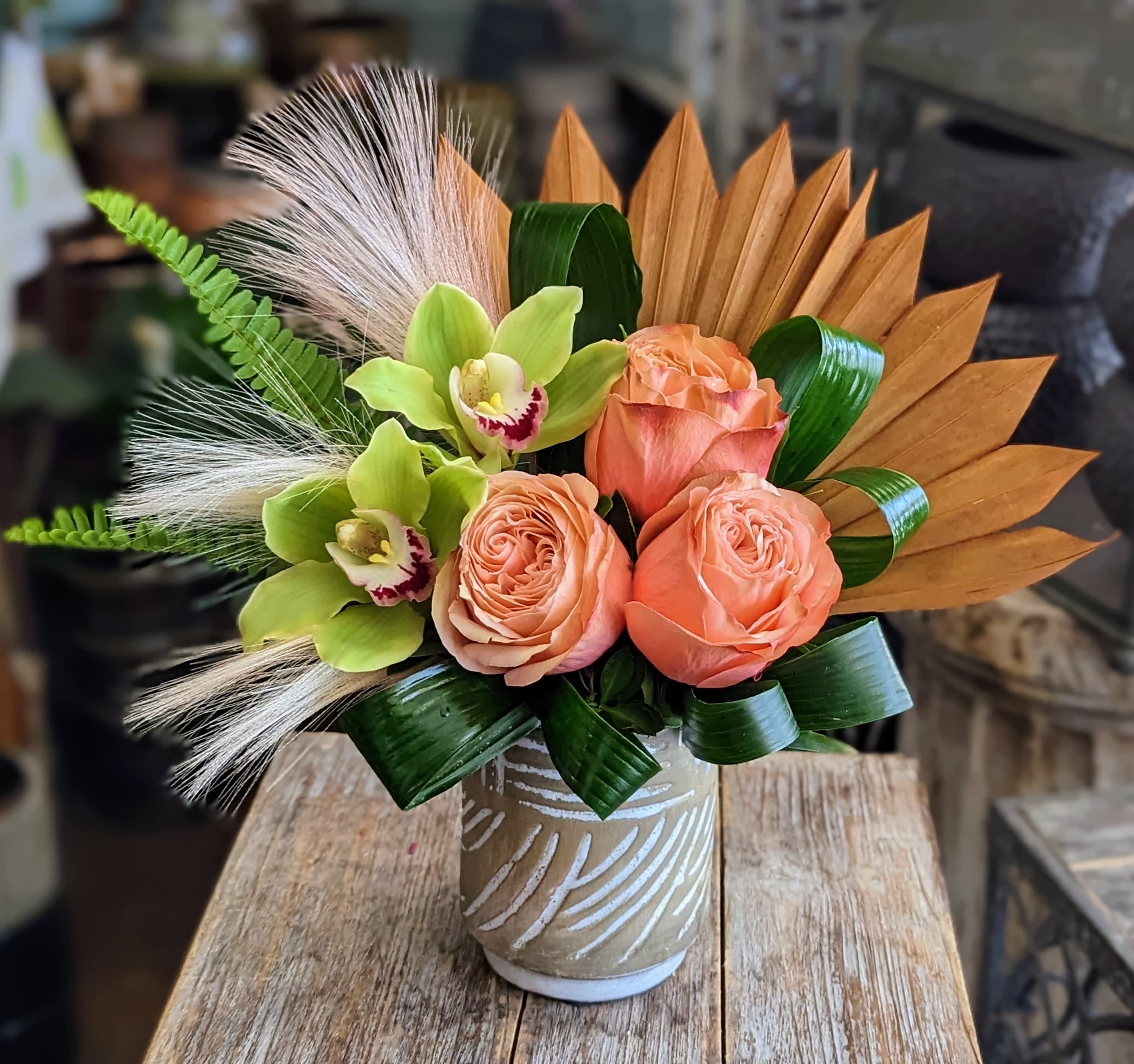Coral- For Delivery To 89123 and 89074 Only - A sweet petite arrangement that includes roses and orchids. Please note, we will not be able to fulfill an order with a zip code other than 89123 or 89074.