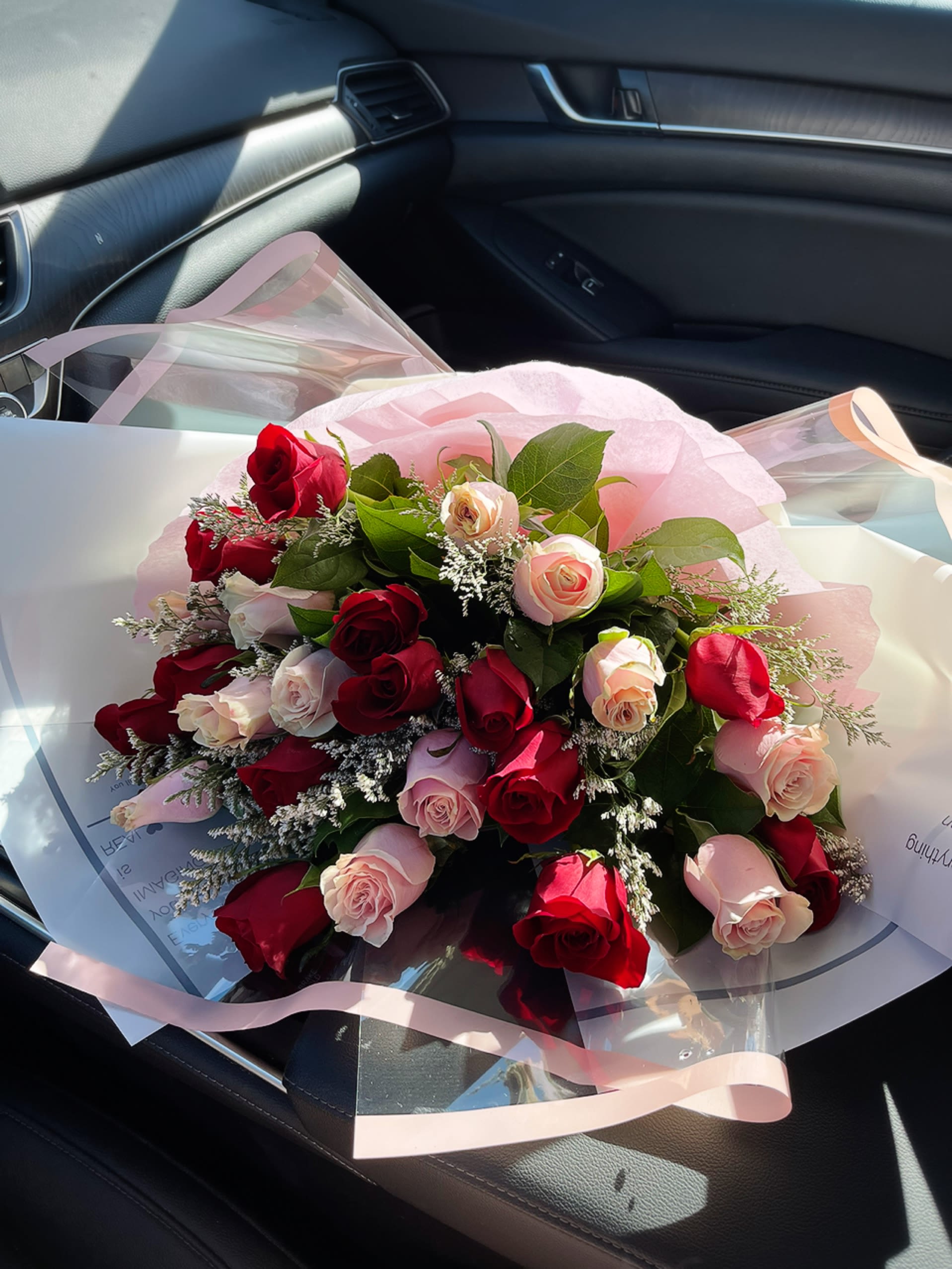 Fancy Roses Hand Arranged Wrap - Size: 30&quot;L x 36&quot;H -15 red roses -15 light pink roses -Baby breath -Greenery -Wraps with pink papers -Bow