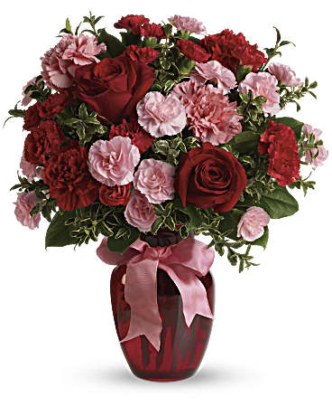 Dance With Me Bouquet - If you want to make a really big impression then fan the flames of love with this sizzling array of red roses and romantic favorites in a classic ruby red vase.  Approximately 14 inches wide and 16 1/2 inches tall for the Standard size.