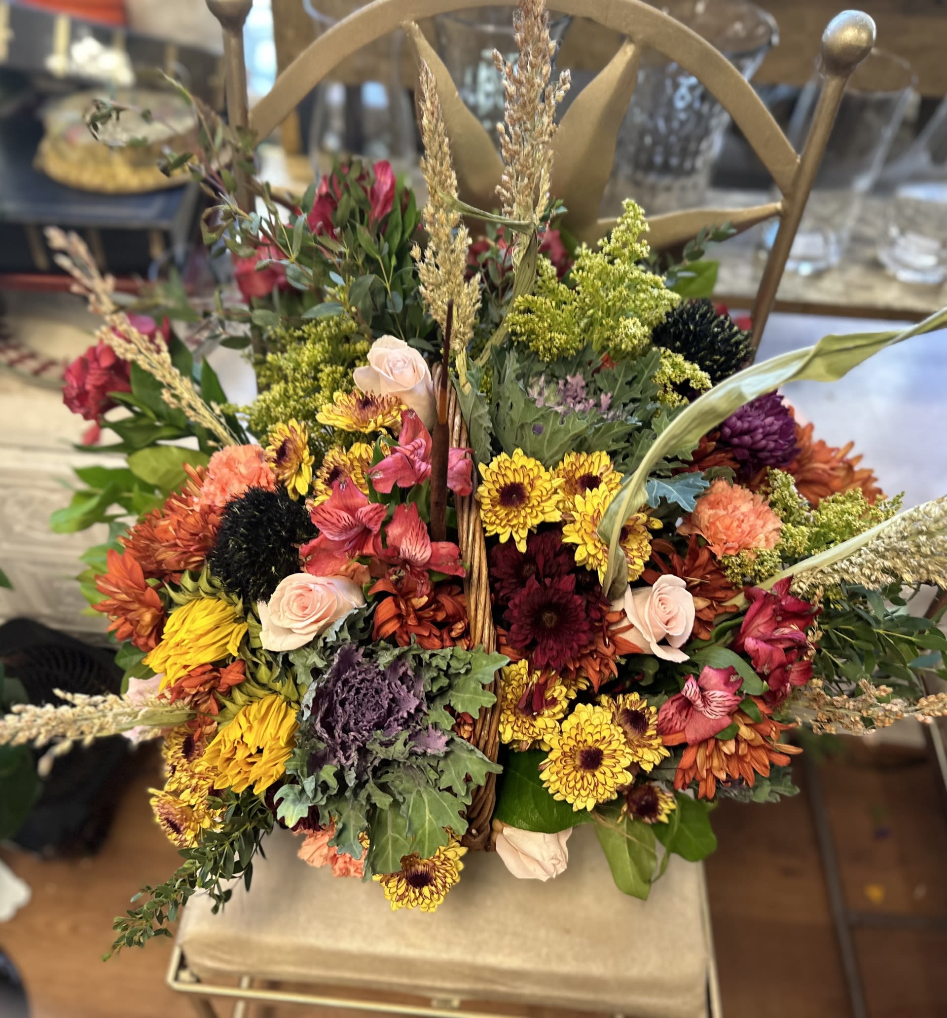 BIGGEST BOUNTY BASKET - HUGE BASKET OF FESTIVE FALL FAVORITES, KALE, MIXED MUMS, ROSES, ASTER, SOLIDAGO AND BROOM CORN SURE TO BE THE TALK OF THE EVENING