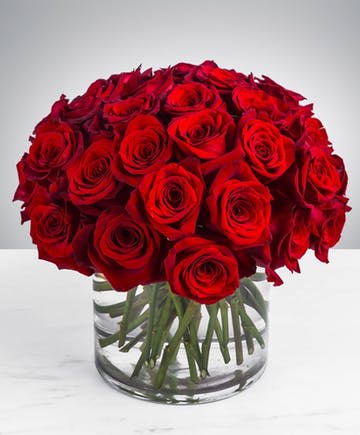 Modern 36 Red Roses  - This timeless modern short three dozen design is tightly gathered into a beautiful dome shape with lush greens. This arrangement is a classic but bold statement piece perfect for all occasions Valentine's Day, Anniversary, or Birthdays.