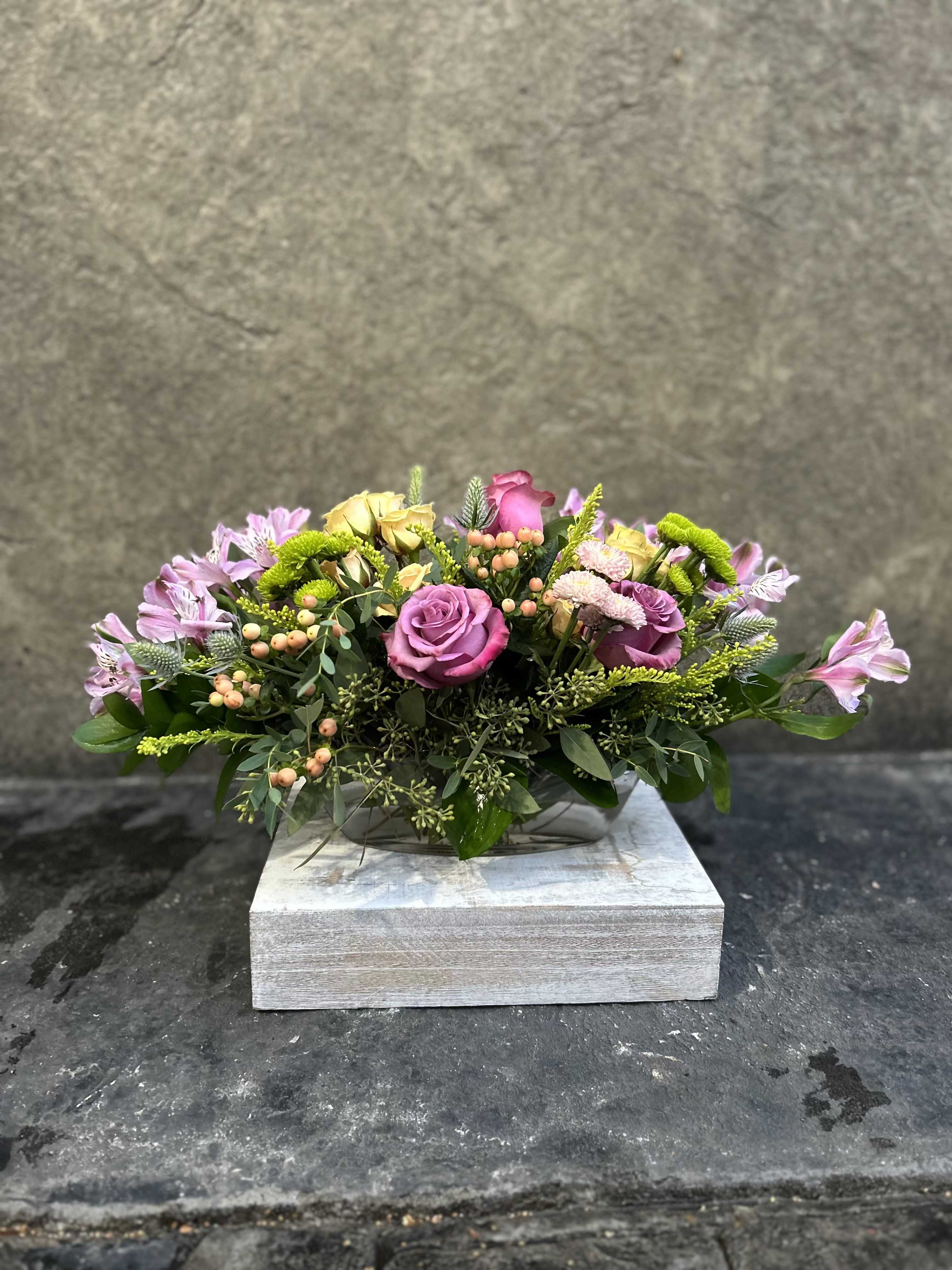Kiwi Punch  - Small glass dish boat with Alstroemeria, berries, buttons, sprays roses and Roses with eucalyptus and other pretty filler blooms.