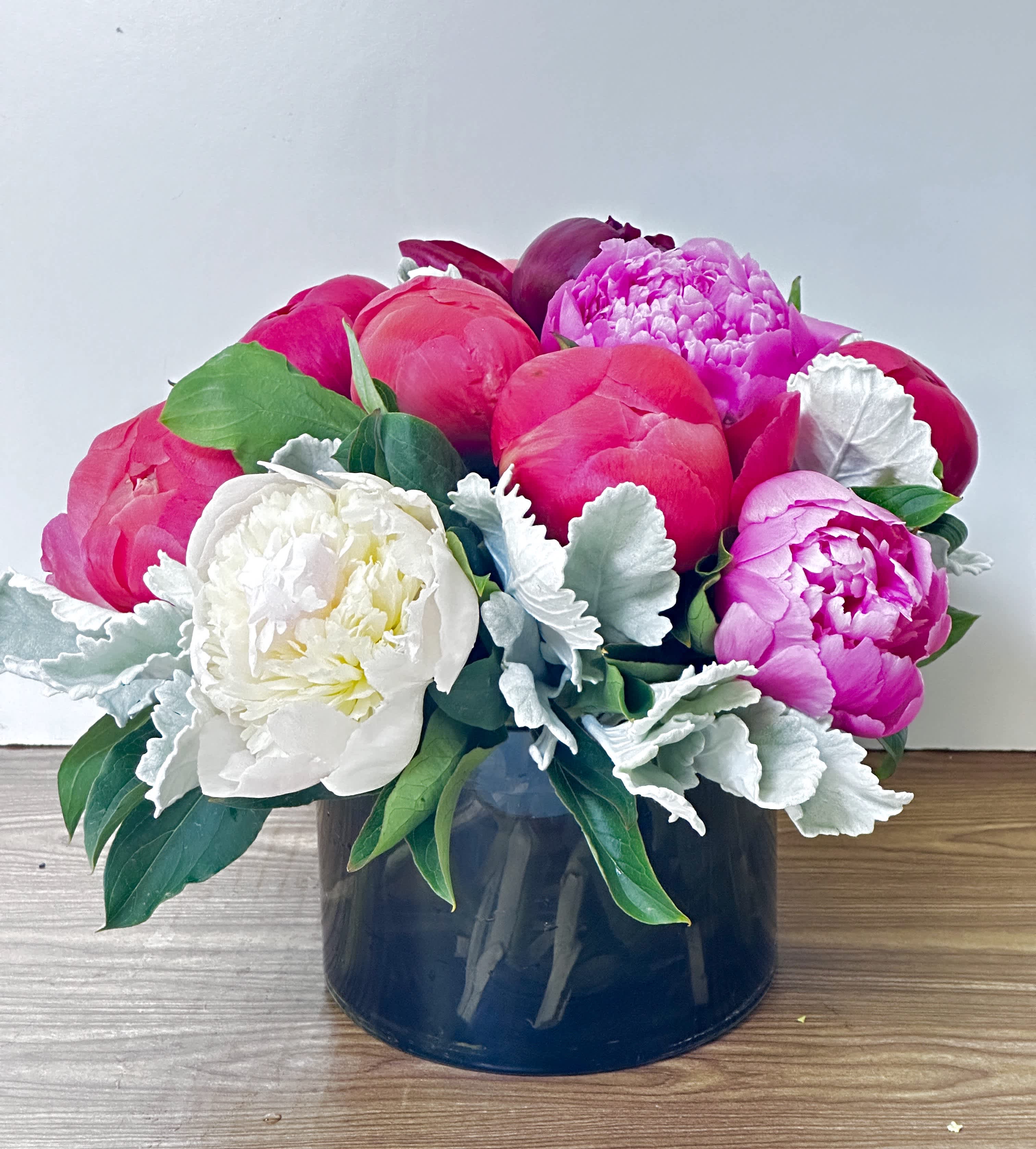 ANYONE BUT YOU - 10 different colors of peonies in a brown glass vase