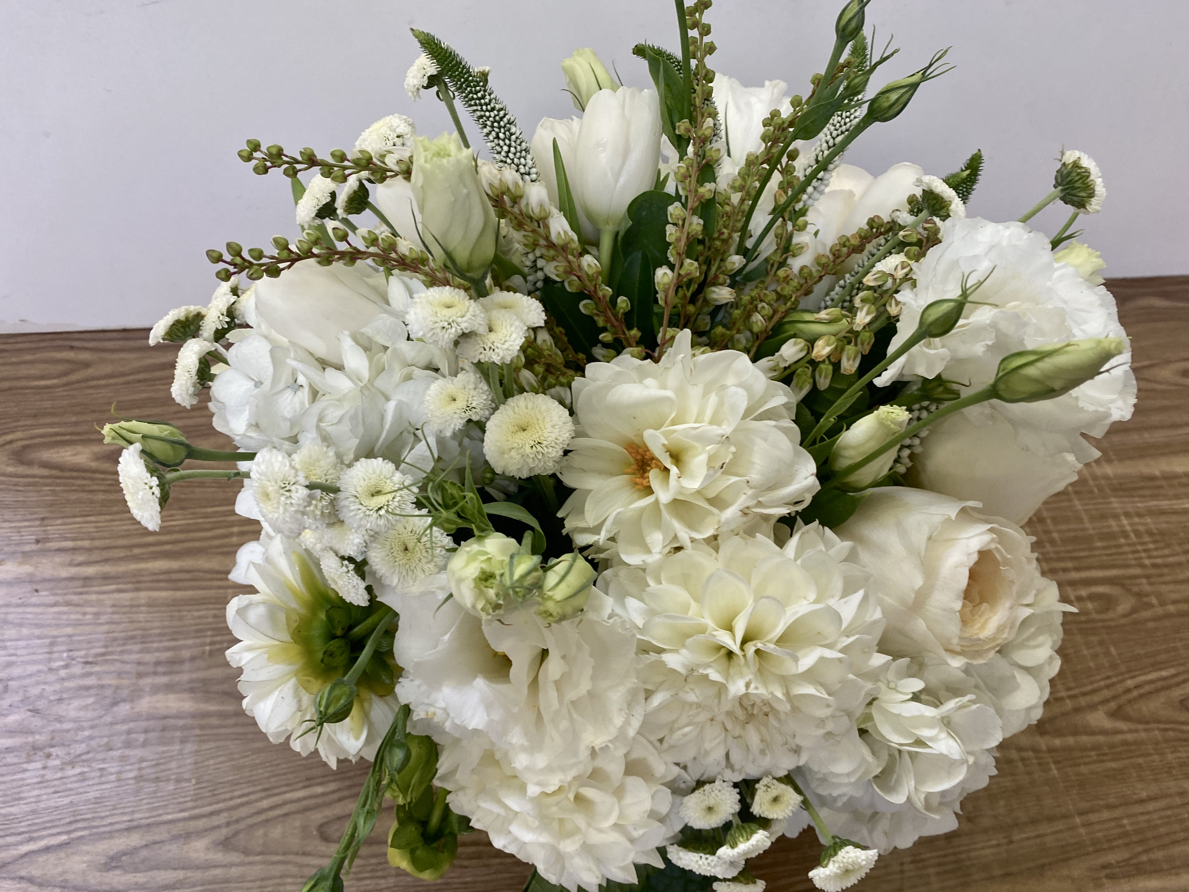 It’s Complicated  - glass vase with a white hydrangea, white dahlia, garden roses and white tulips 