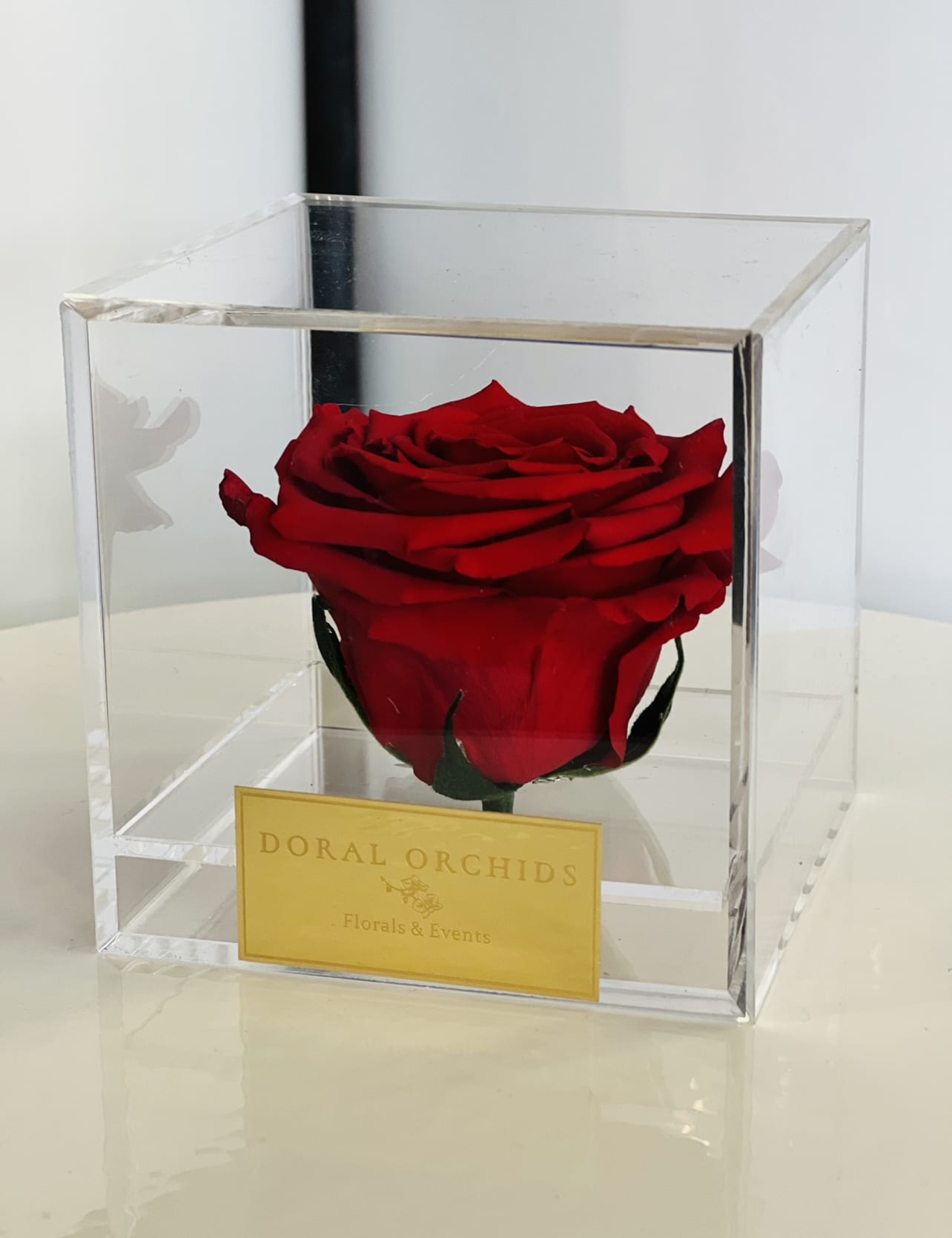 Forever Rose Red ™ - A timeless preserved red rose displayed in a crystal case, radiating passion and elegance. Stays naturally beautiful for 3 or more years.