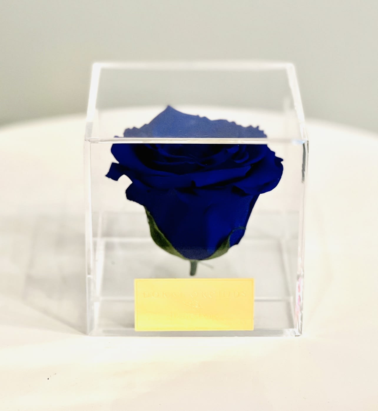 Forever Rose Blue ™ - Bold and unforgettable, this natural preserved royal blue rose is showcased in a modern acrylic cube. Its beauty remains vibrant for 3 or more years.