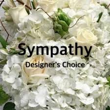 White Designers Choice Sympathy - Let our designer's create a beautiful sympathy arrangement of all shades of white flowers. The arrangement will be appropriate for either service or home. It is the perfect way to honor a loved one when you are just not sure what to send.