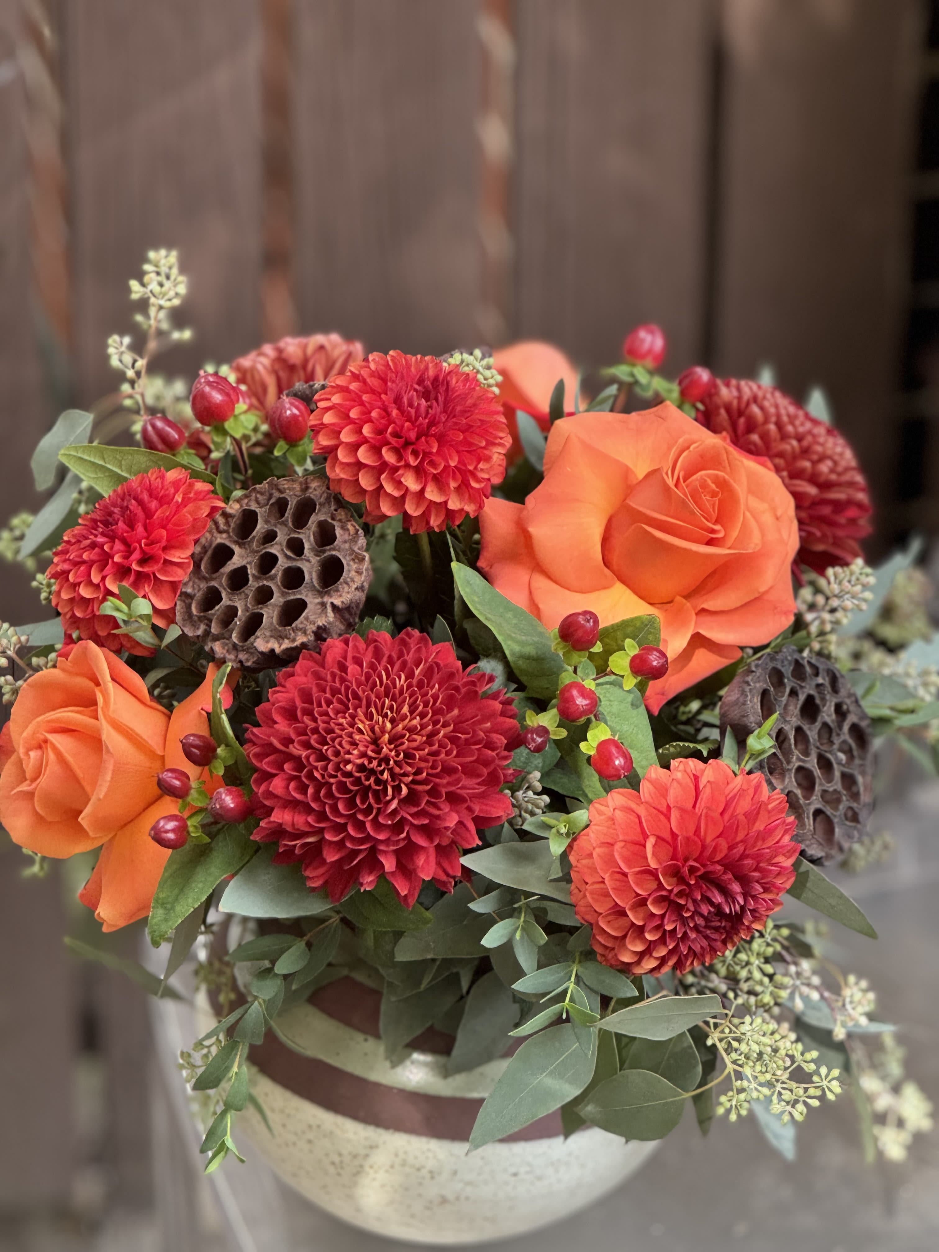 Cinnamon - A collection of beautiful fall hues in Bronze, brown, orange and deep reds presented in our specialty ceramic vase shown.
