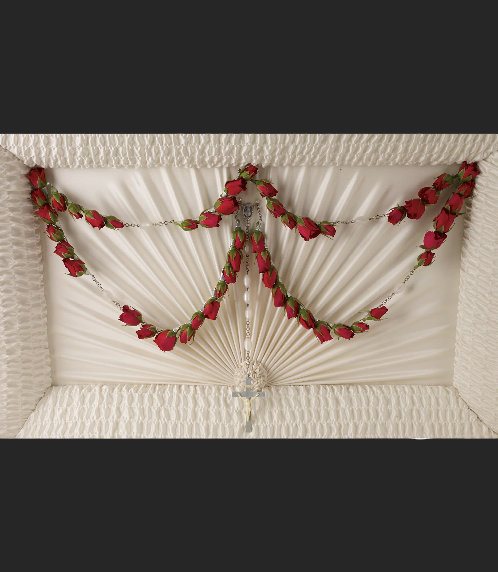 Divine Grace 50-Bead Rosary by Teleflora - For the Catholic service, this exquiste 50-bead rosary graced with red roses placed on the casket lid is a beautifully spiritual tribute to a departed loved one.  