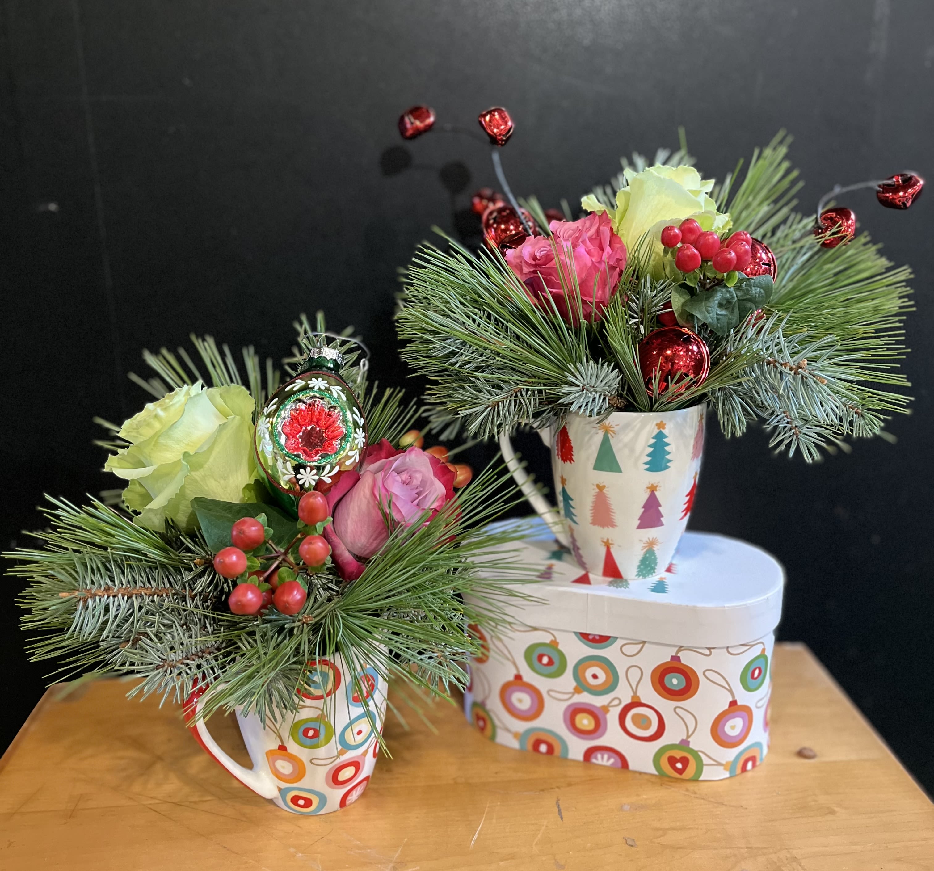 Christmas Delight Mug Set - Holiday mugs are arranged with holiday greens and flowers. Holiday ornaments are added to these whimsical mugs.. Two 13.5 oz Mugs with matching decorative gift box New Bone China Dishwasher/Microwave safe