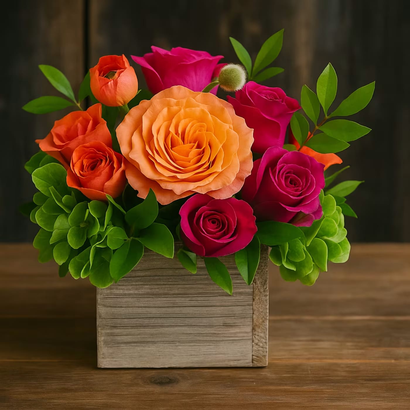 Cheers to you - The Cheers Arrangement is a part of our Petite collection. A cheerful color combination of Pink Spray Roses, Orange Roses, Orange Carnation, Green Hydrangeas in a 4x4 wood planter box. Send someone who needs a little cheer pick me up.