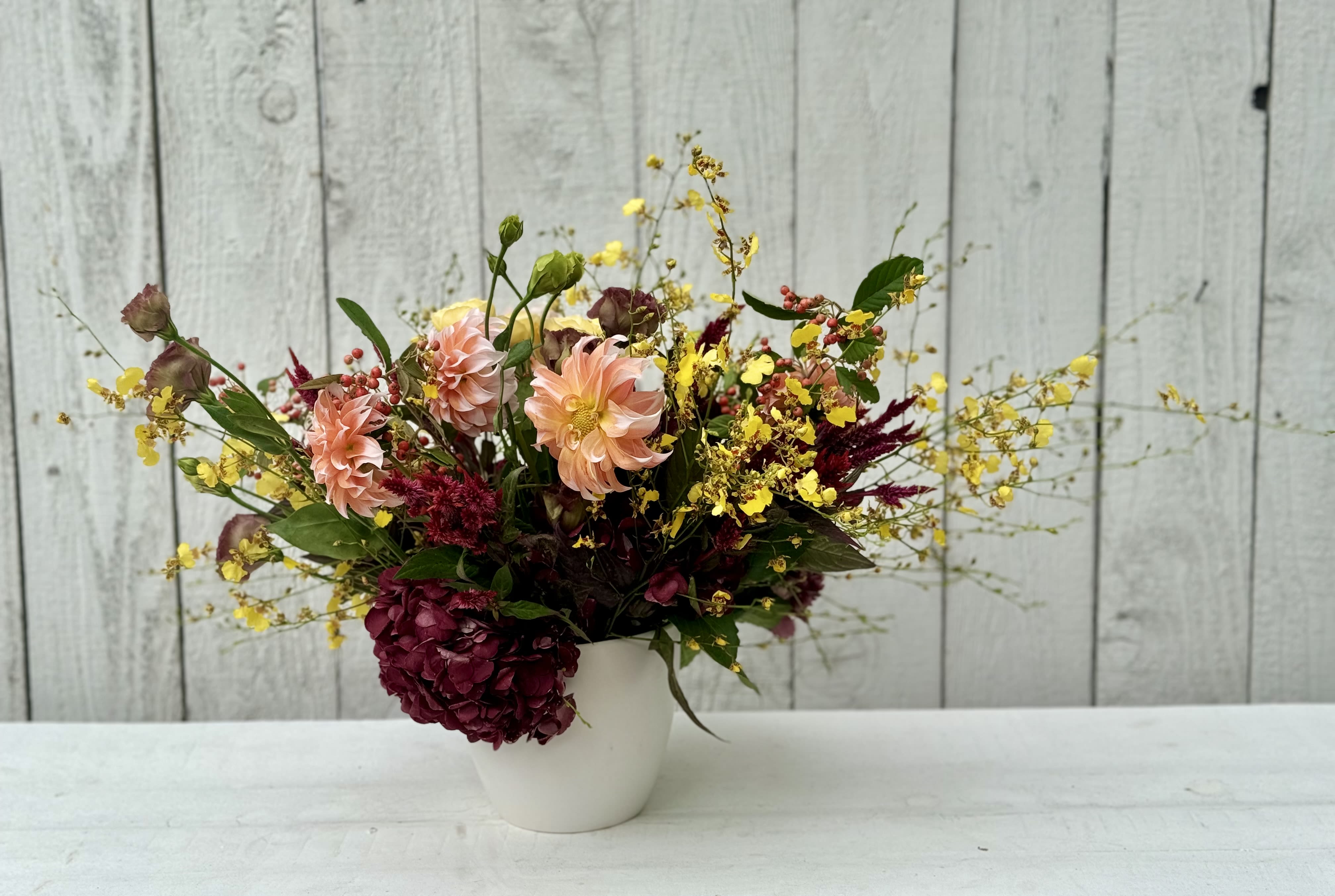 COLOR ME HAPPY - A stunning arrangement with the most beautiful hydrangeas, dahlias,orchids, fall berries, garden roses, and beautiful fall accents…..