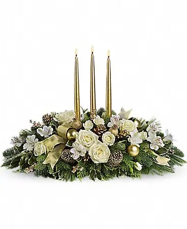 Golden Elegance Holiday Centerpiece – Christmas Flowers - Add timeless sparkle to your holiday table with our Golden Elegance Holiday Centerpiece. This stunning arrangement features creamy white roses, winter greens, pinecones, gold ornaments, and shimmering ribbons, accented by three elegant gold taper candles. Designed to impress, it creates a warm, festive glow for Christmas dinners, winter parties, or holiday décor.  Expertly hand-crafted and delivered fresh by Coco Fresh Flowers, serving Frisco, The Colony, and Little Elm TX.  Perfect for: Christmas dinner centerpieces, holiday gifts, or elegant winter décor.
