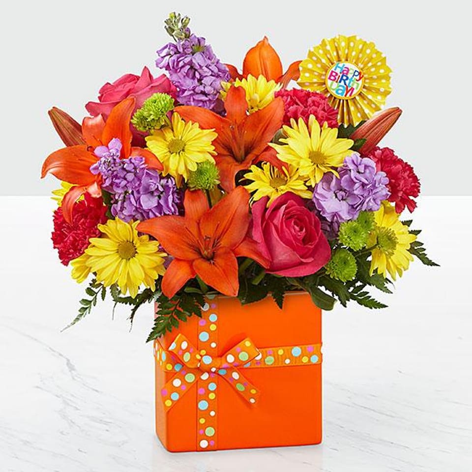 Birthday Gift Box Vase - Product Information Product Information A multi-hued, striped &quot;Happy Birthday&quot; vase is finished with a pretty fabric bow and holds a vibrant arrangement featuring, heavy-weight paper &quot;Happy Birthday&quot; pic. 6&quot;W x 2 3/4&quot;D x 6&quot;H.