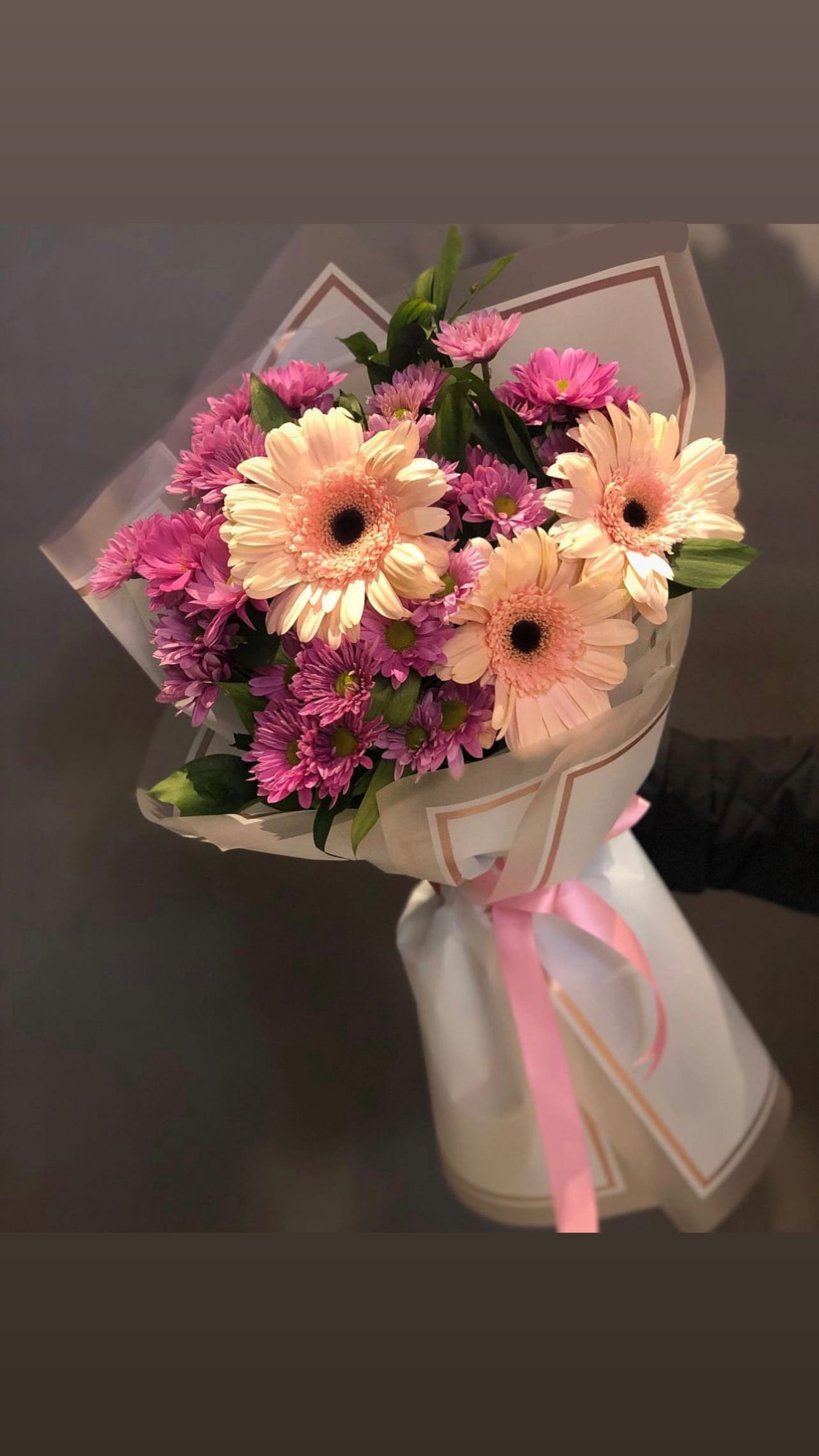 Gerba Love Bouquet - DESCRIPTION: BOUQUETS NEVER EVER are identical, they come out different every time please keep this in mind! your bouquet will have similar flowers, similar colors and similar theme :-)  if youd like to customize your rose color or wrapping color please give us a call and we will give you alot more options over the phone! 937-689-6325  Note: Hand bouquets do not include a vase.