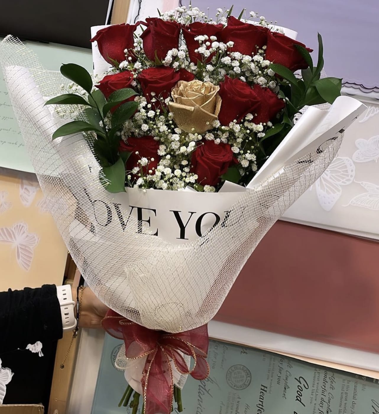 Gold Dzn Galore -  Indulge in the opulent allure of this exquisite bouquet, meticulously crafted to captivate the senses and evoke a sense of timeless elegance. Adorned with a symphony of vibrant red roses and delicate white flowers, this floral masterpiece exudes an air of sophistication and grace. Each bloom, carefully selected for its impeccable beauty and fragrance, harmoniously intertwines to create a stunning visual spectacle that will leave a lasting impression. Whether it is a gesture of love, celebration, or simply to add a touch of luxury to any space, this bouquet is a true testament to the artistry of nature.