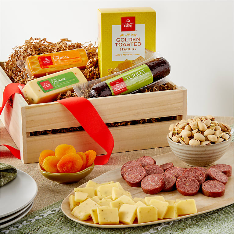 Meat &amp; Cheese Charcuterie Gift Basket - MEAT &amp; CHEESE CHARCUTERIE GIFT BASKET  Spread a blanket and feel the warmth of California's golden breezes when this fabulous gift arrives! A rustic wooden crate holds a delicious sampling of gourmet treats including California nuts, tasty dried fruit, cheese &amp; crackers, and sausage. Fabulous! DETAILS  This gift contains nuts. Arrives in a rustic wooden crate and tied with a solid red ribbon. Includes California nuts, dried fruit, assorted cheese, crackers and sausage.