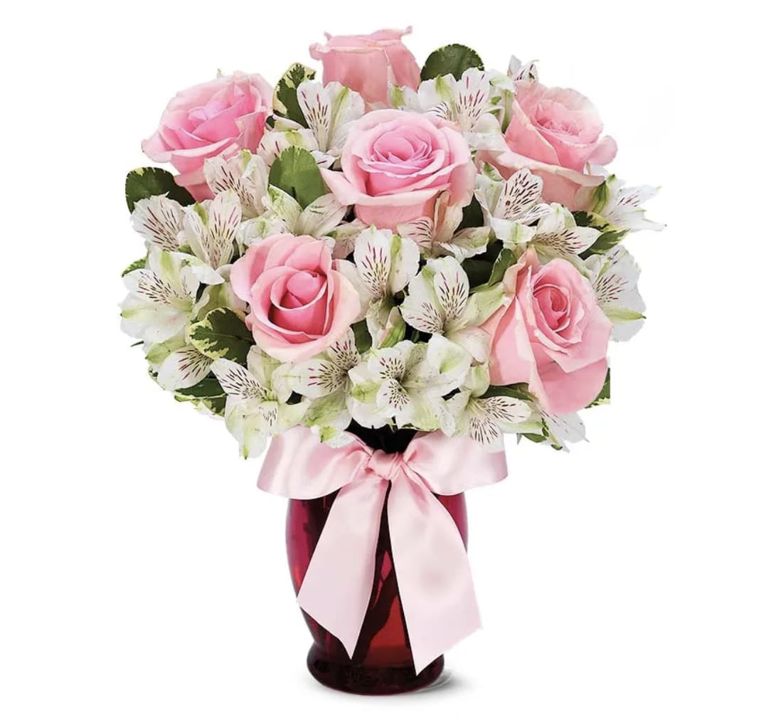 Pink and Pretty - Add a touch of pink to her day with this Pink and Pretty Bouquet. Available for delivery today, this mixed flower bouquet is created with cute pink roses and white alstroemeria stems by one of our florist partners. The pink roses and white alstroemeria are sent in a pink fluted vase wrapped with a pink bow, hand delivered to a business or home. The Pink and Pretty arrangement is a great gift for a birthday or Mother's Day!   Includes:  • Pink Roses  • White Alstroemeria  • Red or Pink Fluted Vase  • Decorative Ribbon