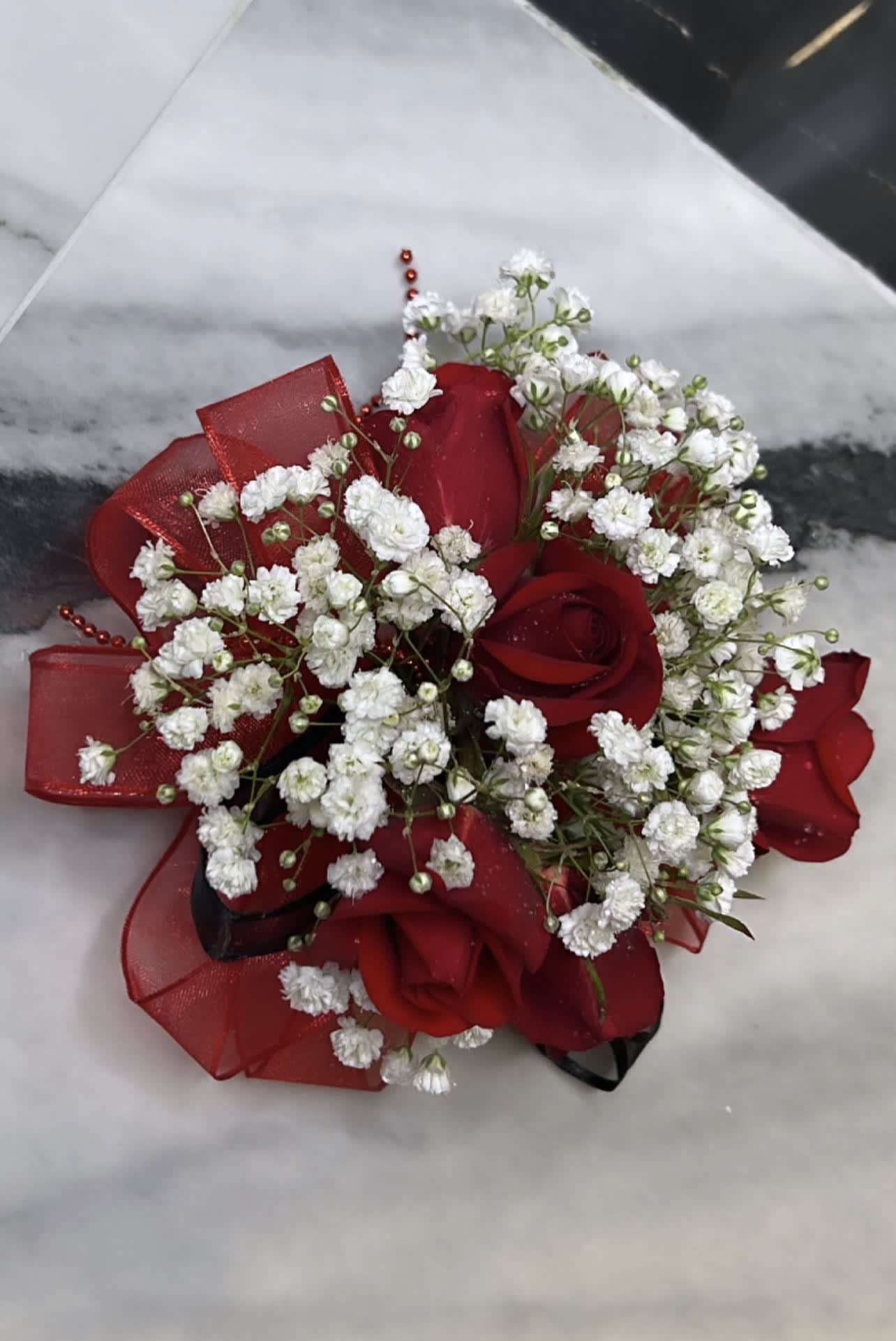 Red Rose Corsage by BloomNation™ - A classic red rose and baby's breath corsage compliments any outfit. Perfect for prom, formal, and weddings.