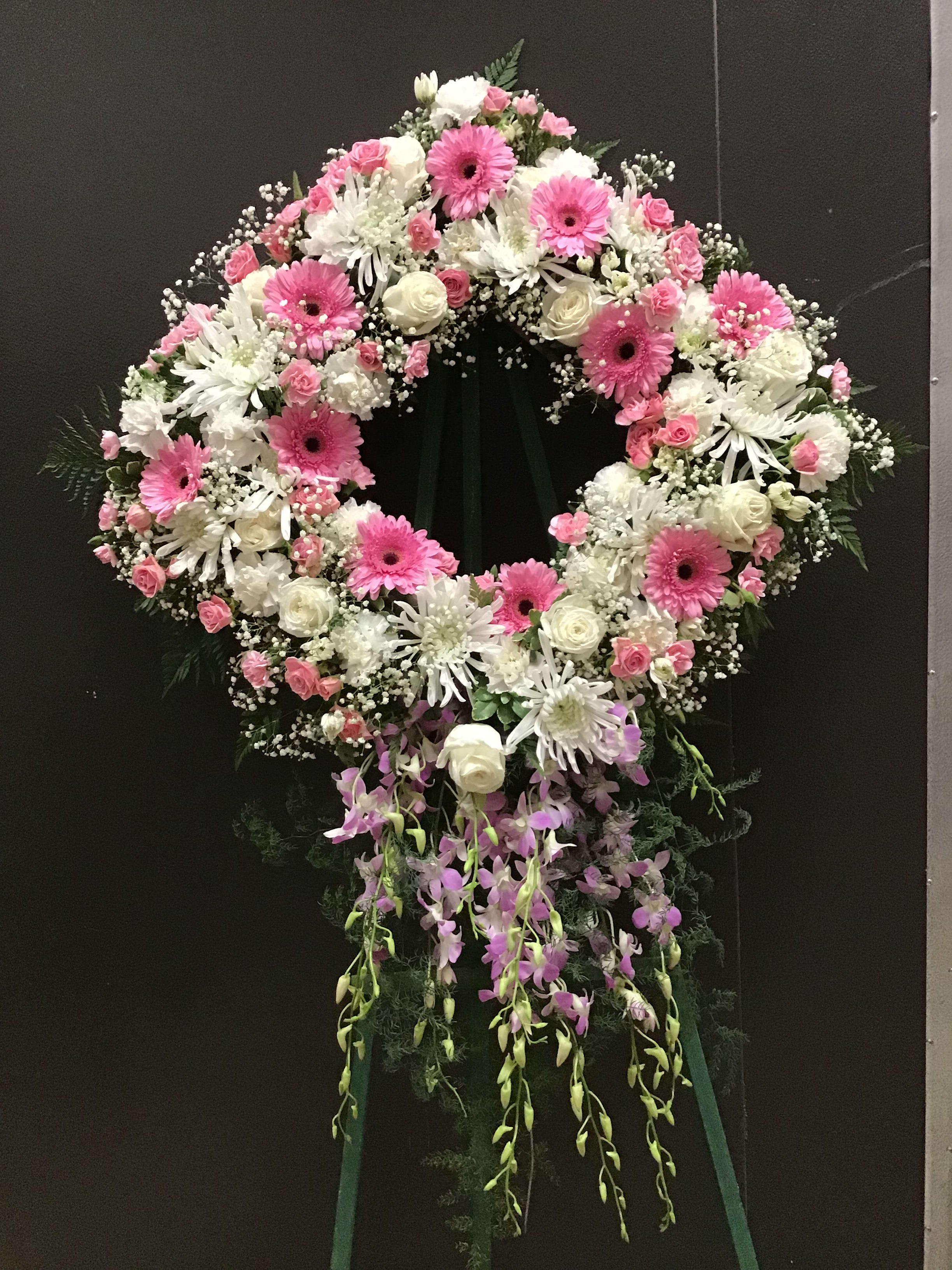 Angel Love - This beautiful standing diamond sharp arrangement, make with White roses, spider mum, carnations, and pink gerbera spray roses and dendrobium orchid. 