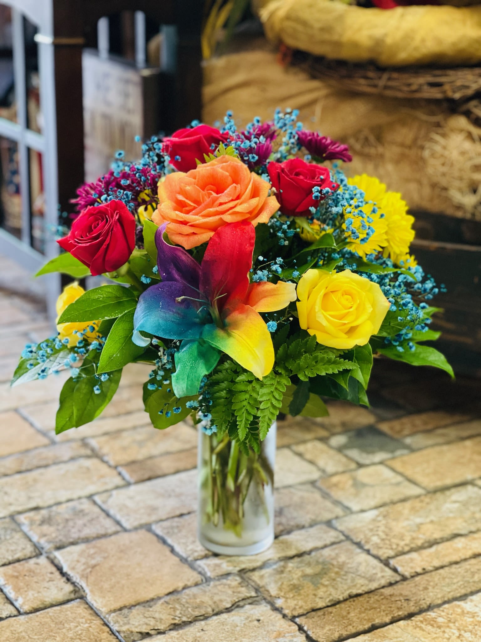 Rainbow Road - This vibrant arrangement showcases all the colors of the rainbow, creating a stunning display that's bursting with joy. Each bloom contributes to a beautiful spectrum, making it a true celebration of nature's palette.