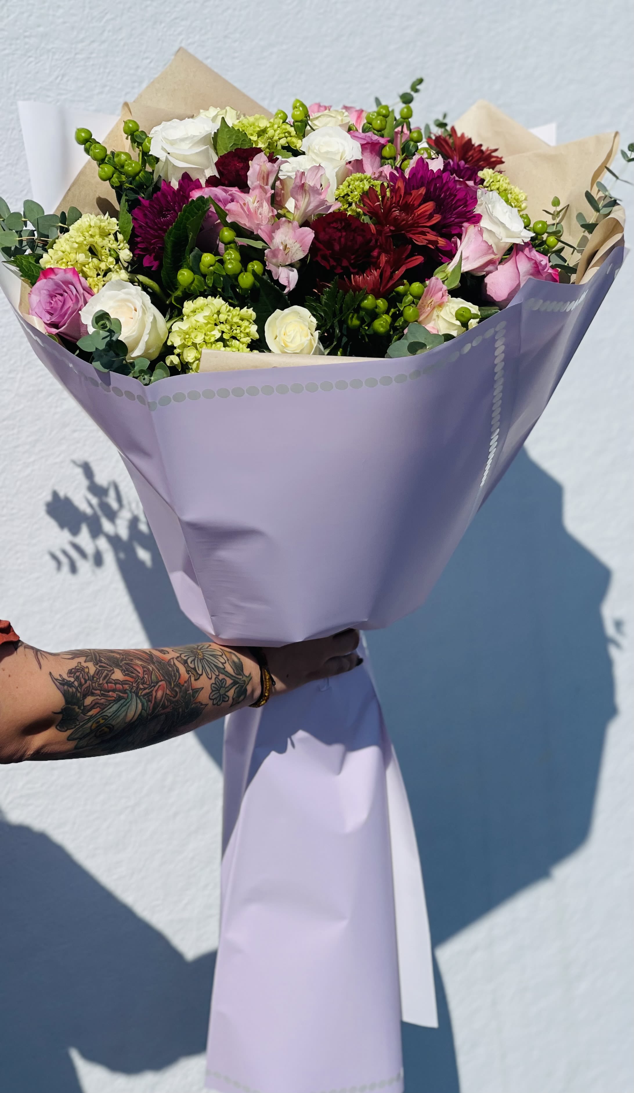 Purples  - A purple flower arrangement is elegant and sophisticated, often symbolizing royalty, creativity, mystery, and admiration ??. It can range from soft and romantic to bold and dramatic, depending on your flower choices and color pairings.