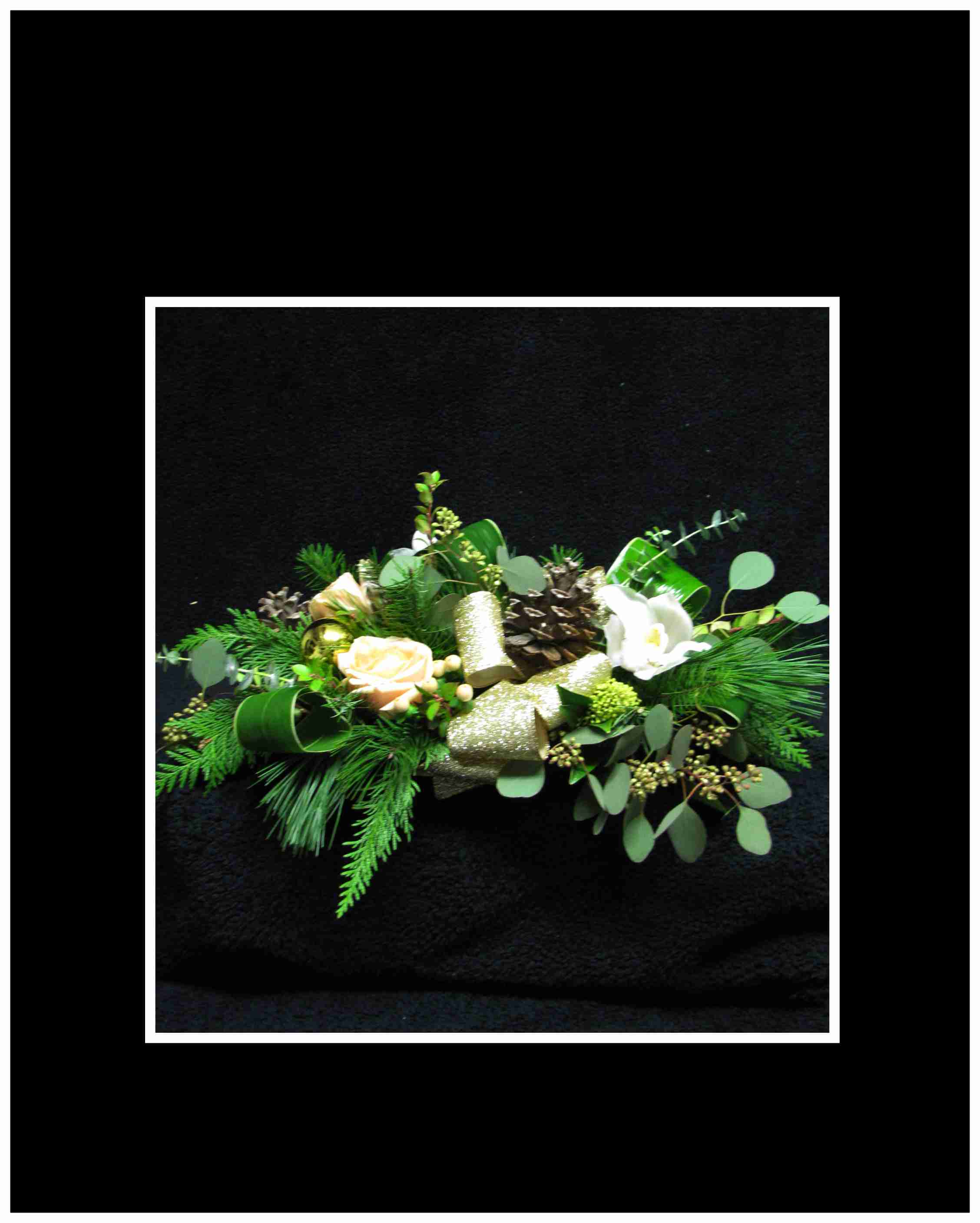 Festive Shimmer - This wonderful arrangement has white cyms, peach roses, peach hypericum berries, branches, pine cones, seasonal greens, arranged in a low container for a wonderful display at Christmas.  Approximately 9&quot;&nbsp;H X 18 L x 12&quot; W