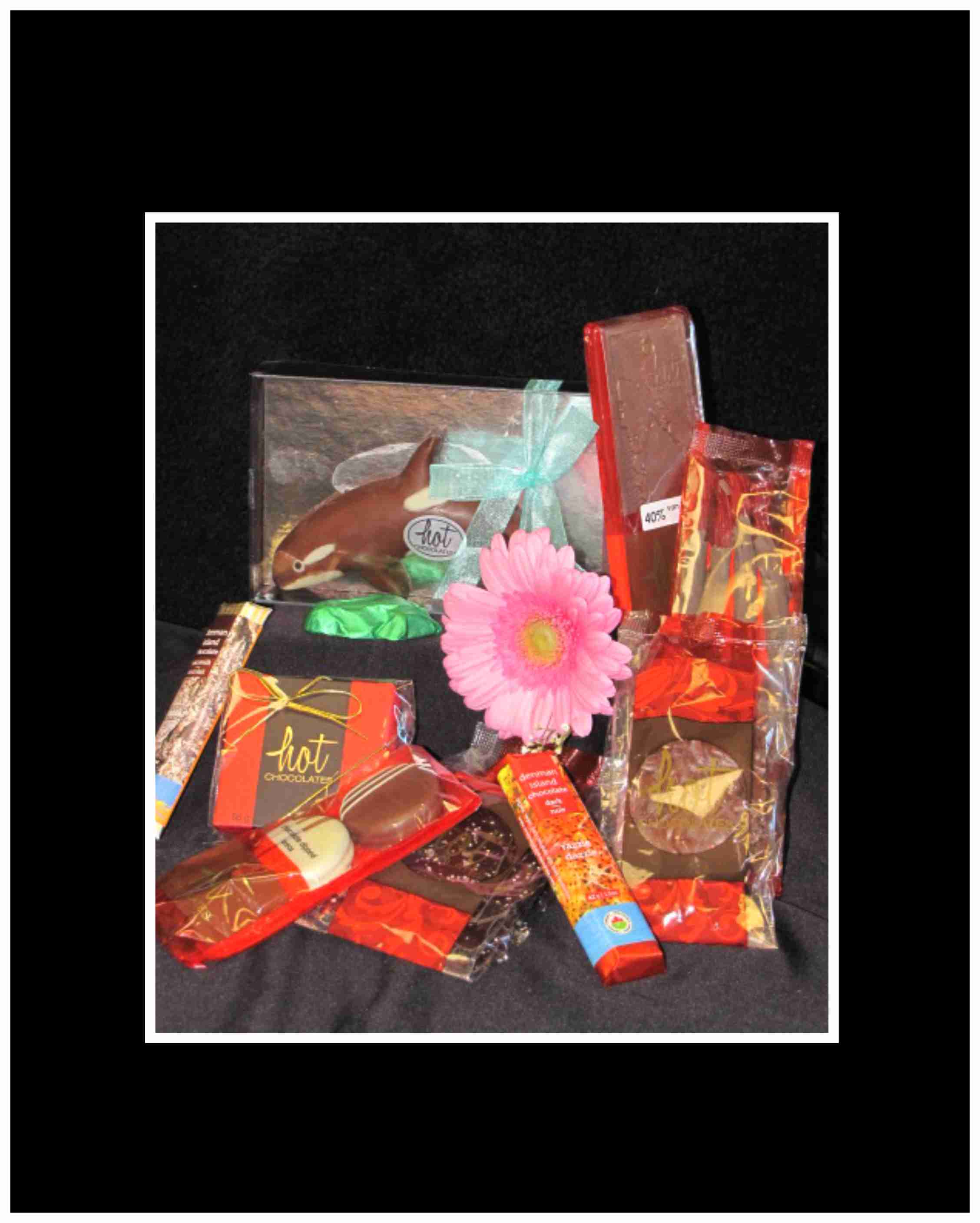 Chocolate Lovers Gift Basket - This unique basket is filled for Chocolate Lovers, Hot&nbsp;Chocolate box of 4 truffles, Hot Chocolate Bark, and a Hot Chocolate chocolate bar, Chocolate dipped caramel pretzels, Chocolate drenched oreo cookies, Wild Culture cookies,&nbsp;and of course Denman Island chocolate bars, Denman Island Chocolate Frog that are all natural, placed in a basket, wrapped and tied with a bow.