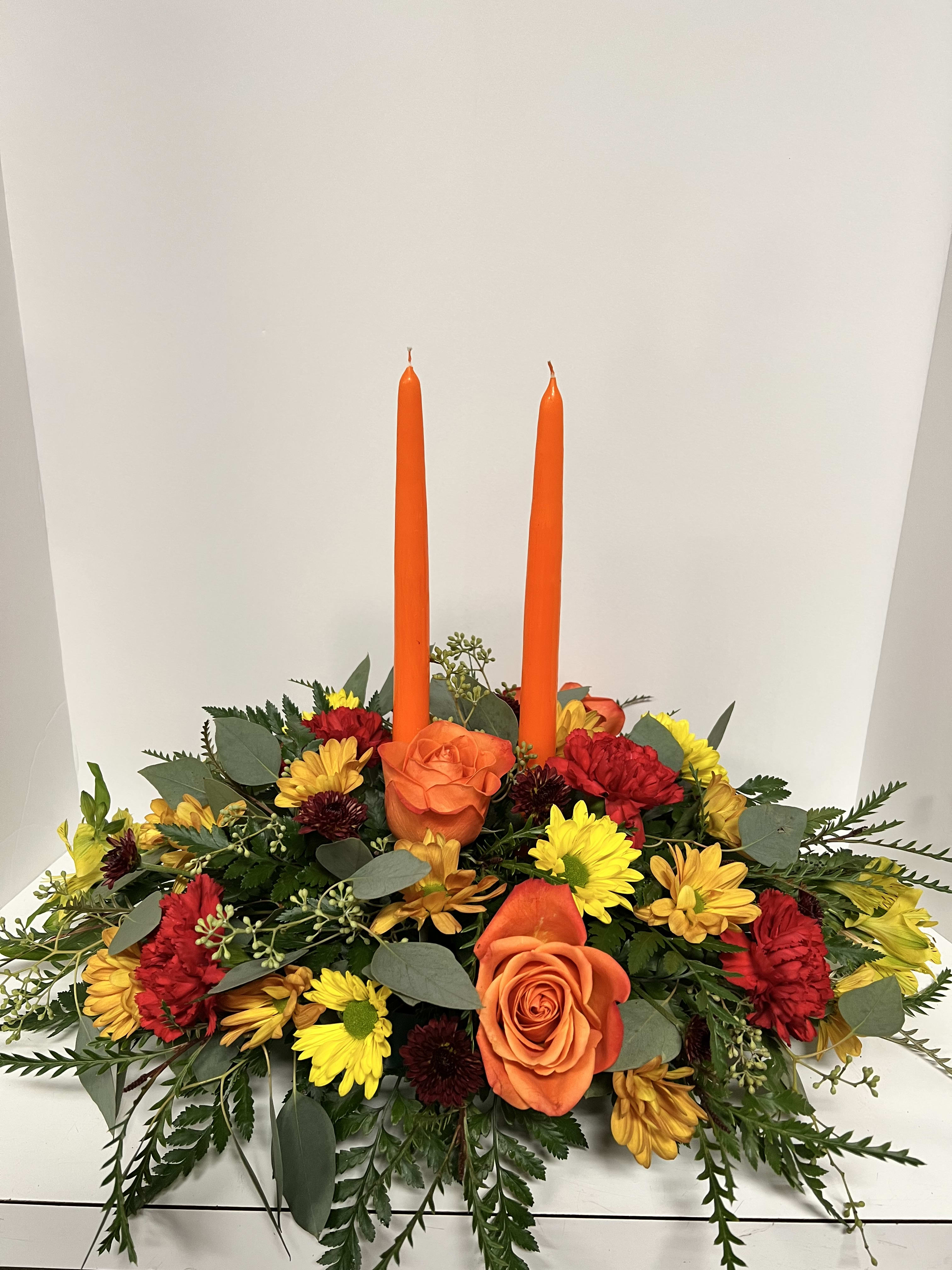 Thanksgiving Centerpiece  - PICTURED 59.95 Fresh assorted fall flowers in a wonderful thanksgiving piece for your family's table over the holiday season. 