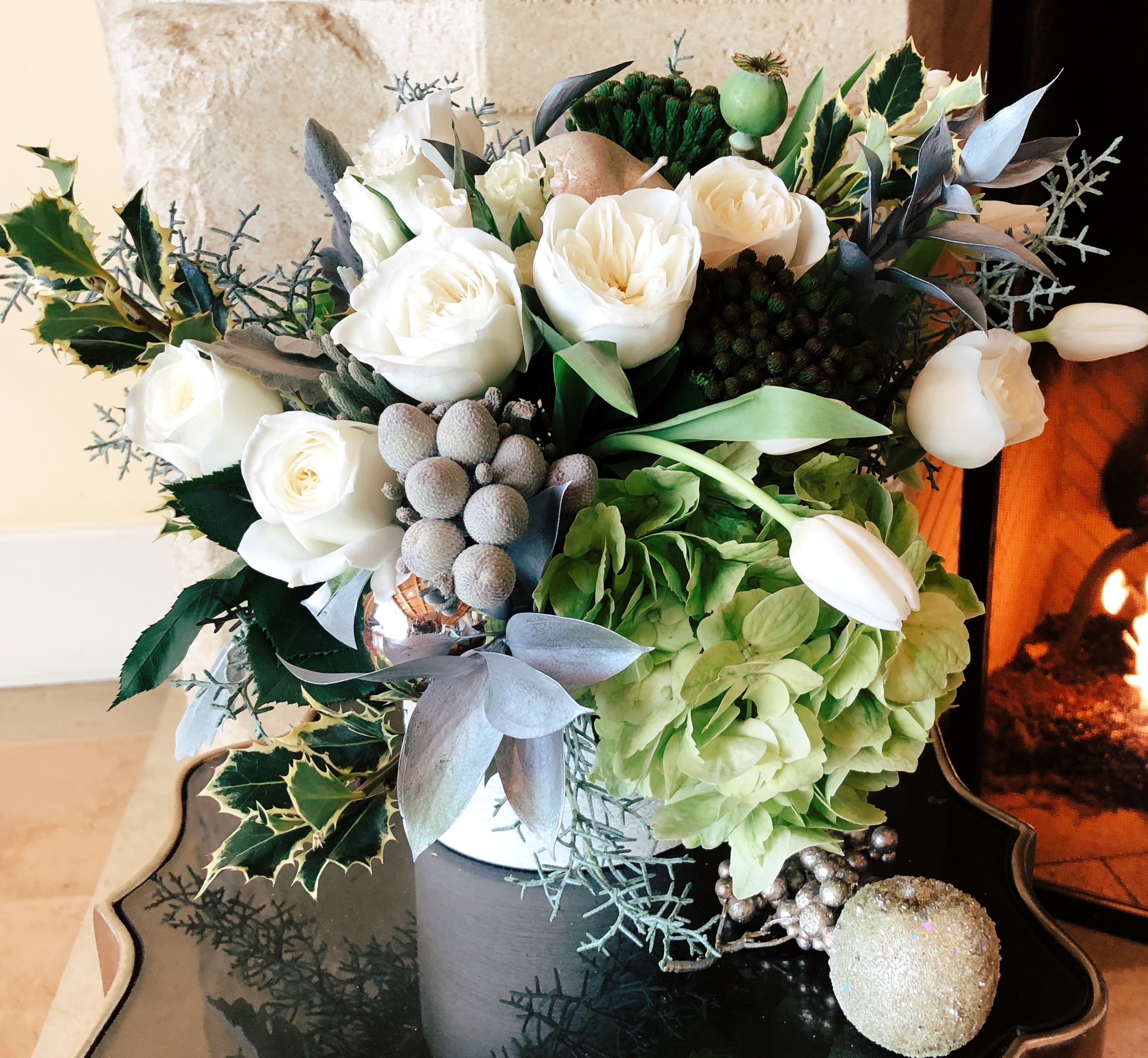  SPIRIT OF LOVE - A special and very classy design with crisp white tulips, lighter green hydrangea, white garden roses, and fresh amazing smelling greens.. It comes in a beautiful  6x6 white container....