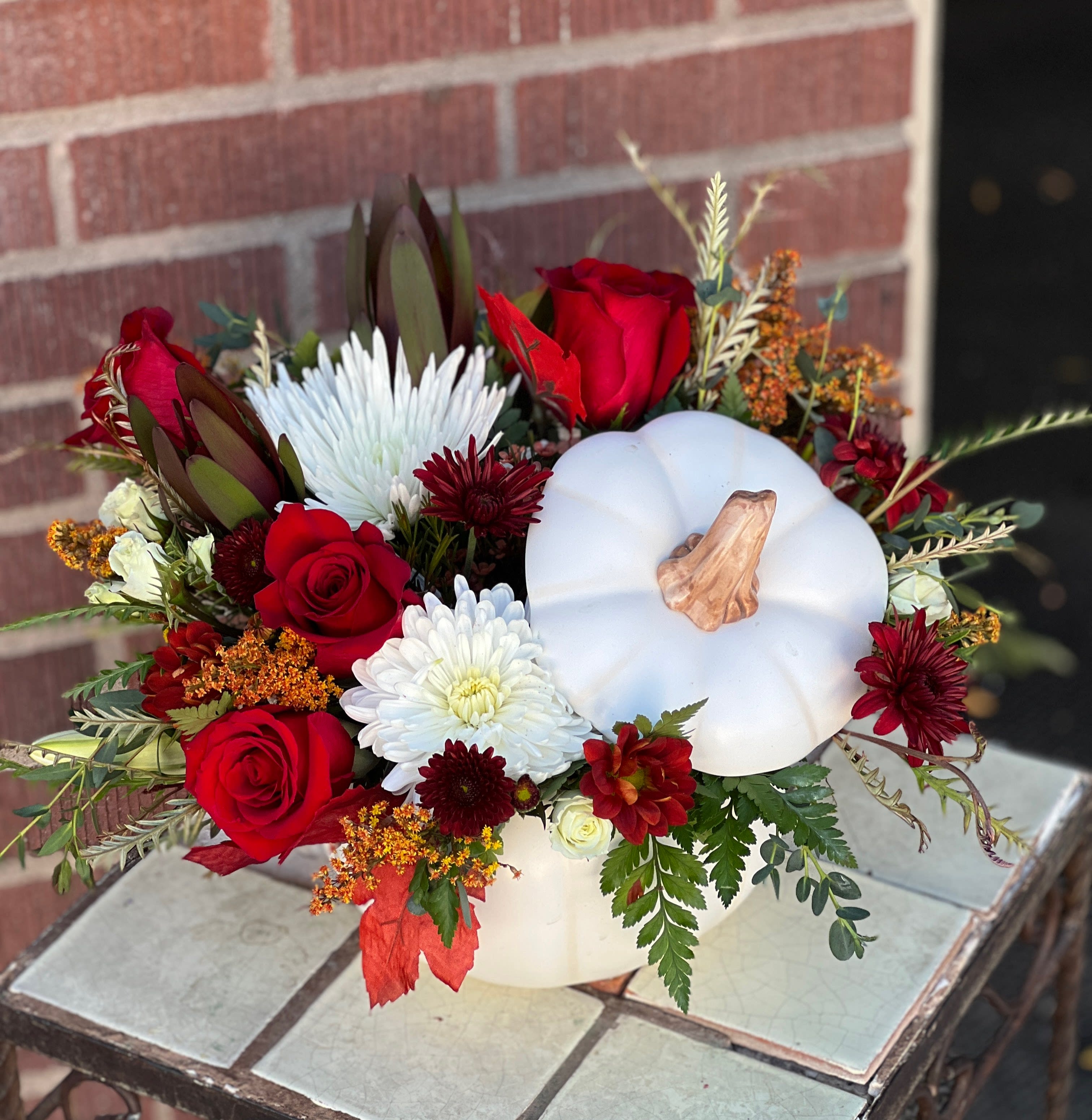 Stylish Pumpkin Bouquet  - In shades of white, red and fall hues, this white ceramic pumpking comes with a lid and is quite large, and doubles well as a snack/candy/cookie jar!