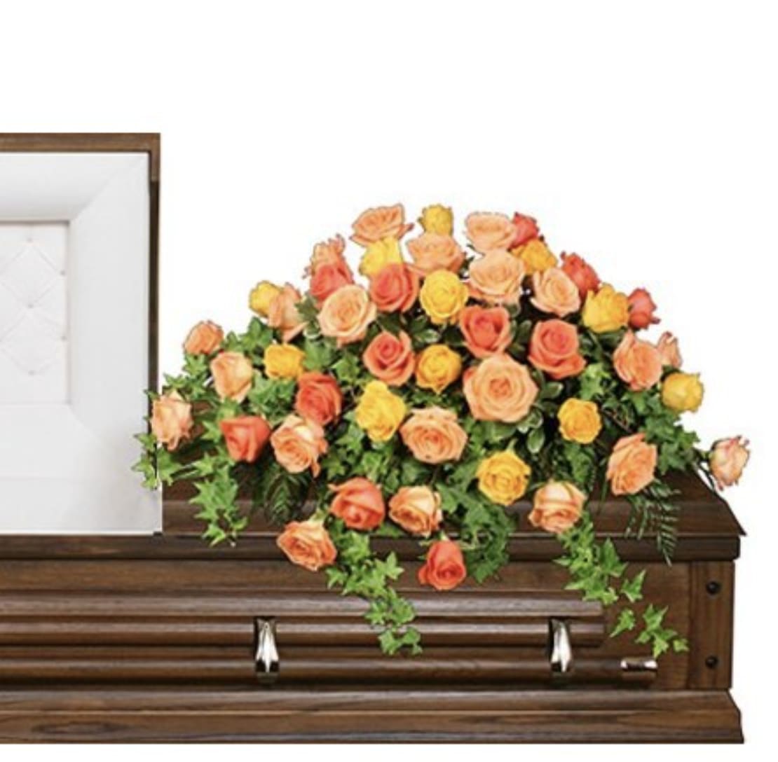 Beautiful Rose Benediction Casket Spray  - A casket spray with a stunning collection of orange and yellow roses that are beautifully arranged   A unique arrangement hand created by our experienced designers. Please note that every design is custom made and substitution to container and flower types may happen from time to time. Design aspects will always stay the same, but if needed, we will substitute with flowers of equal or greater value to offer you a great floral shopping experience! Our flowers are 100% guaranteed. Please call us with any questions or concerns.