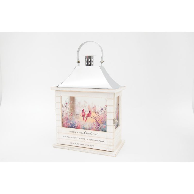 Cardinal Wooden Lighted Lantern - Our Wooden Slat lanterns are made with quality wood with a stainless steel finish top. They come inscribed with sentimental quotes amid beautiful artwork on all four sides and a charming flameless LED candle. Suitable for hanging or use as a freestanding item. They are weather friendly!  3 AAA batteries are included. Comes with a matching bow.  If you would like a silk floral arrangement on lid choose Deluxe.   Lantern Reads: &quot;When you see a Cardinal, You will know it's true, I'm never far away, I'm always here with you.&quot;  W: 8.75&quot; H: 12.5&quot; D: 5.25&quot;