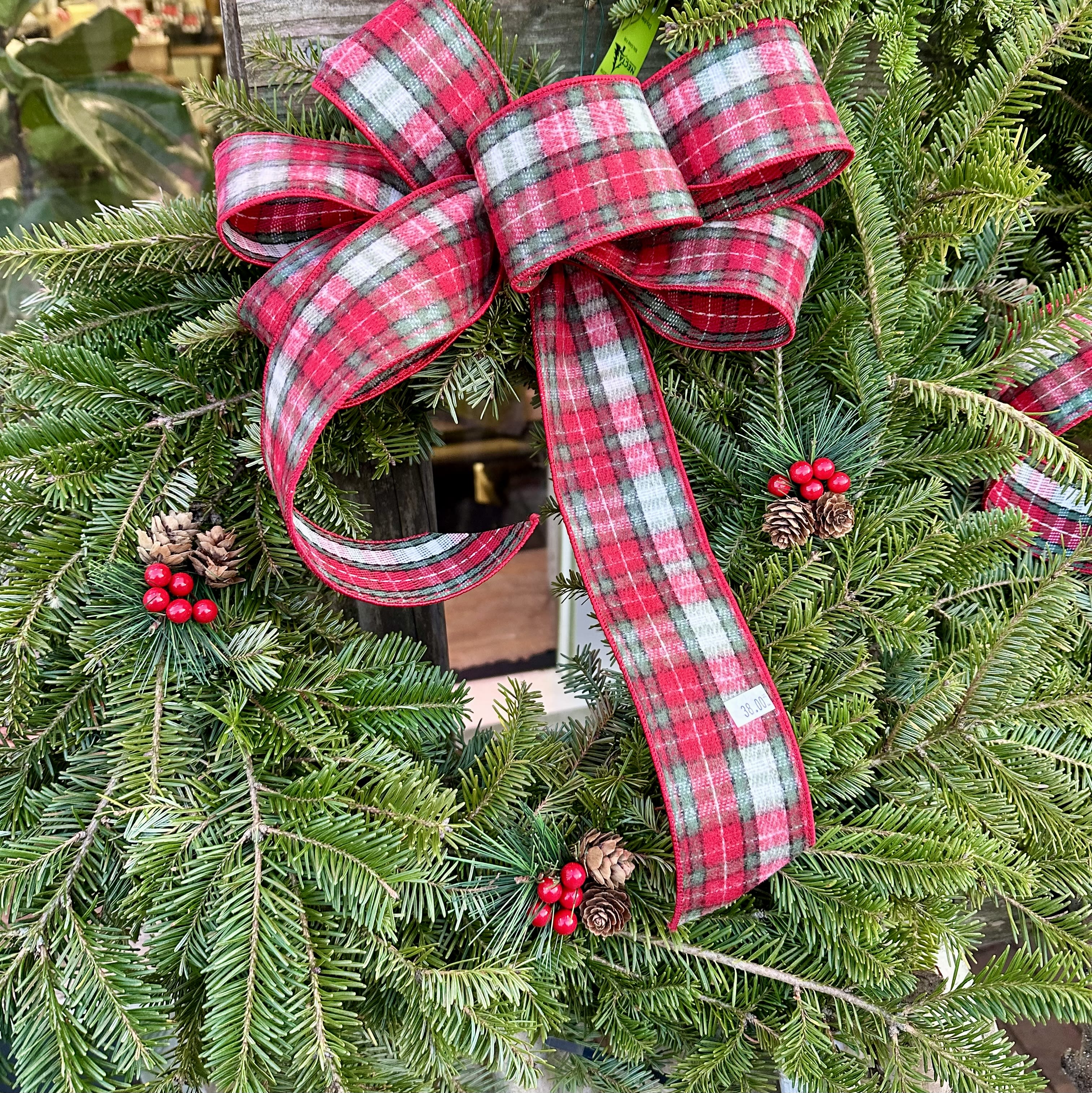 Holiday Natural Wreath -  A feeling of “Welcome home” with this custom balsam living wreath. Dressed in Birch ribbon and natural pine cones. 