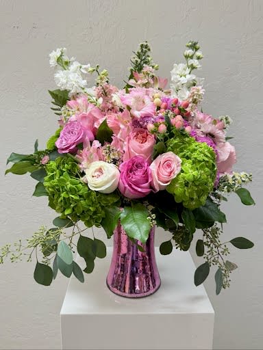 Blush and bloom - A radiant mix of pink and white roses, lush green hydrangeas, and delicate seasonal blooms arranged. This charming bouquet exudes elegance and joy, perfect for celebrating love, friendship, or special moments. Fresh, feminine, and timeless — it’s a beautiful way to make any day bloom.