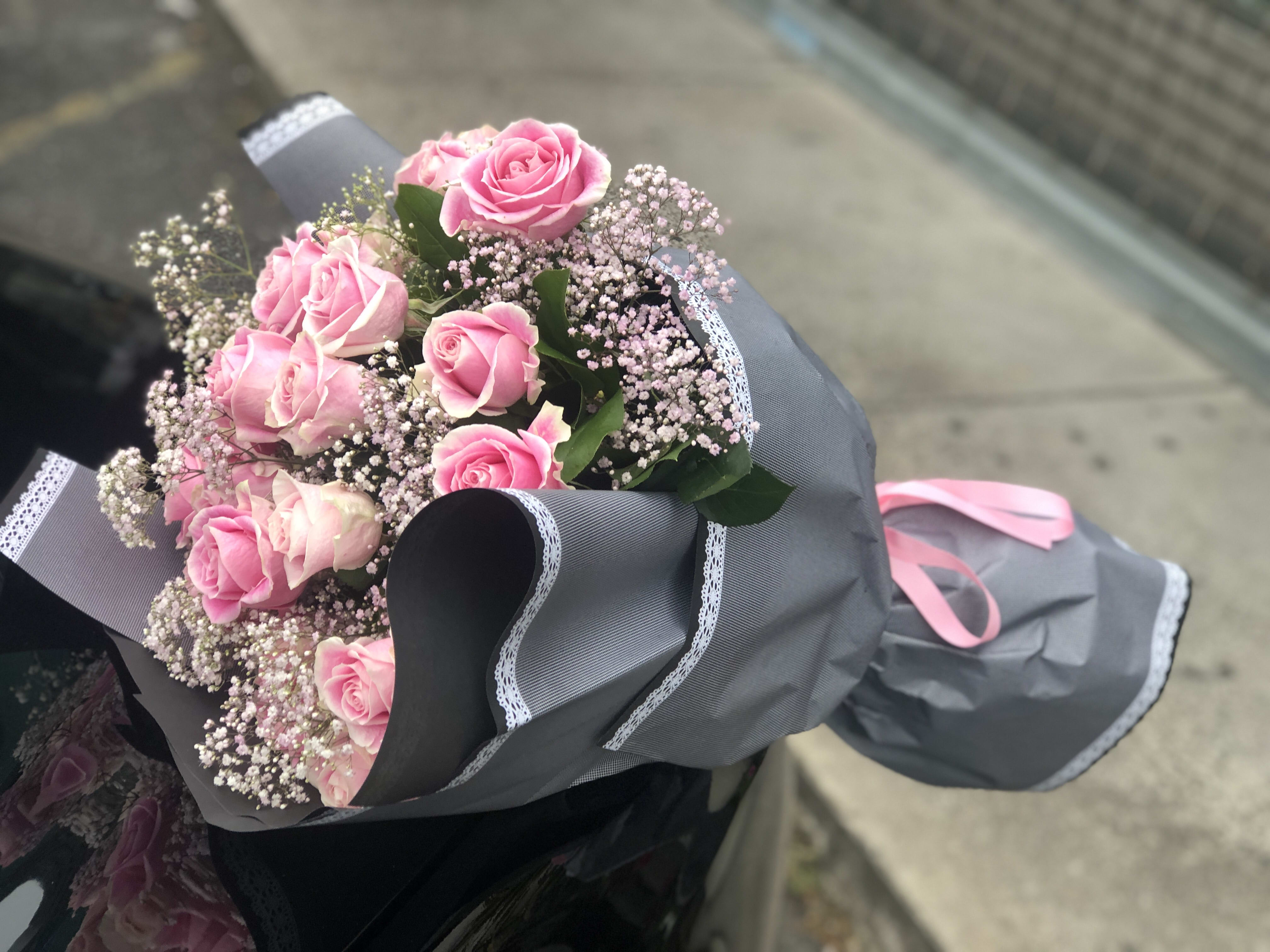 Lovely pink  - 12 pink roses with babies breath wrapped beautifully 